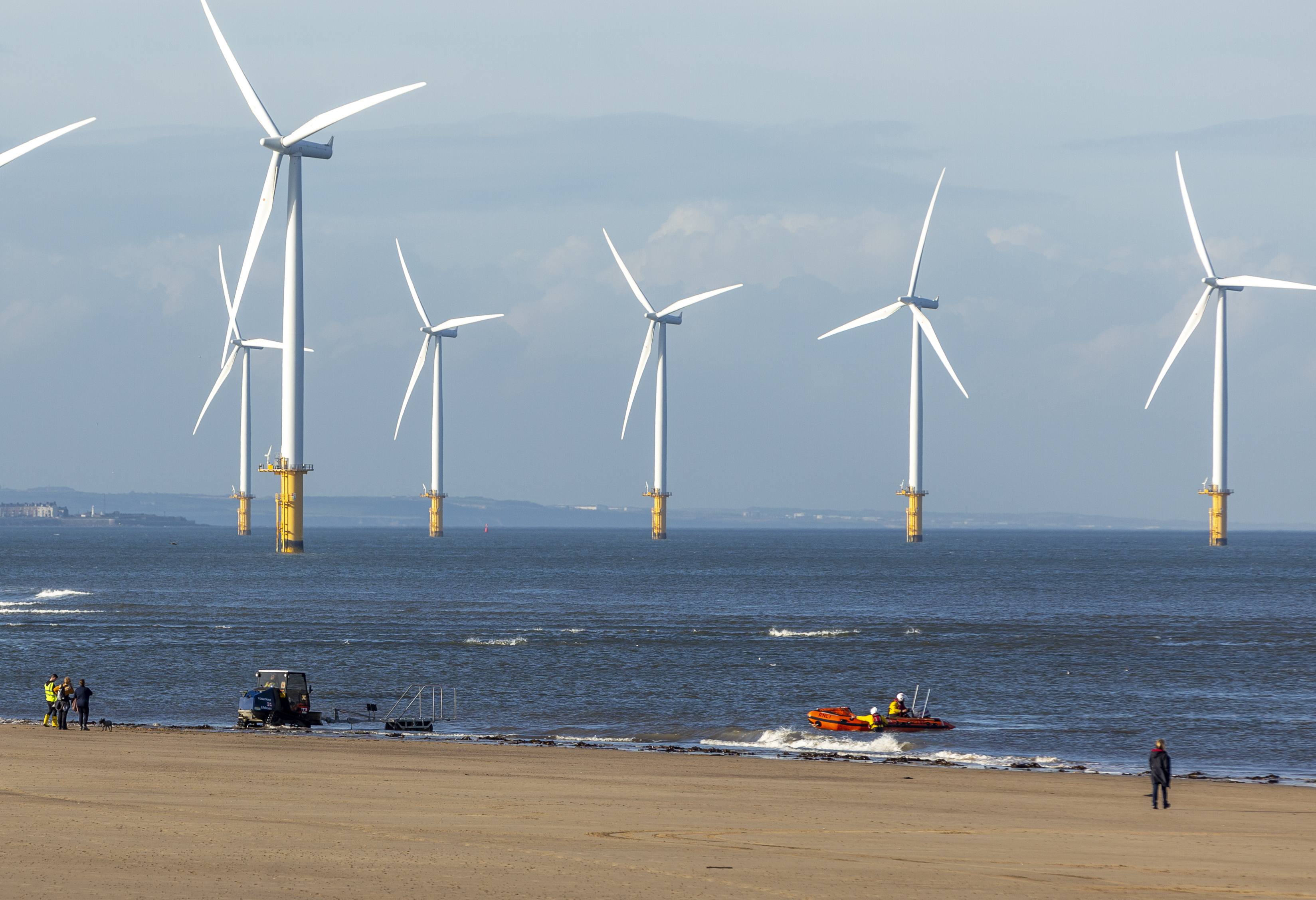 Two adults cut off by the tide at Redcar were rescued by the town's inshore lifeboat.