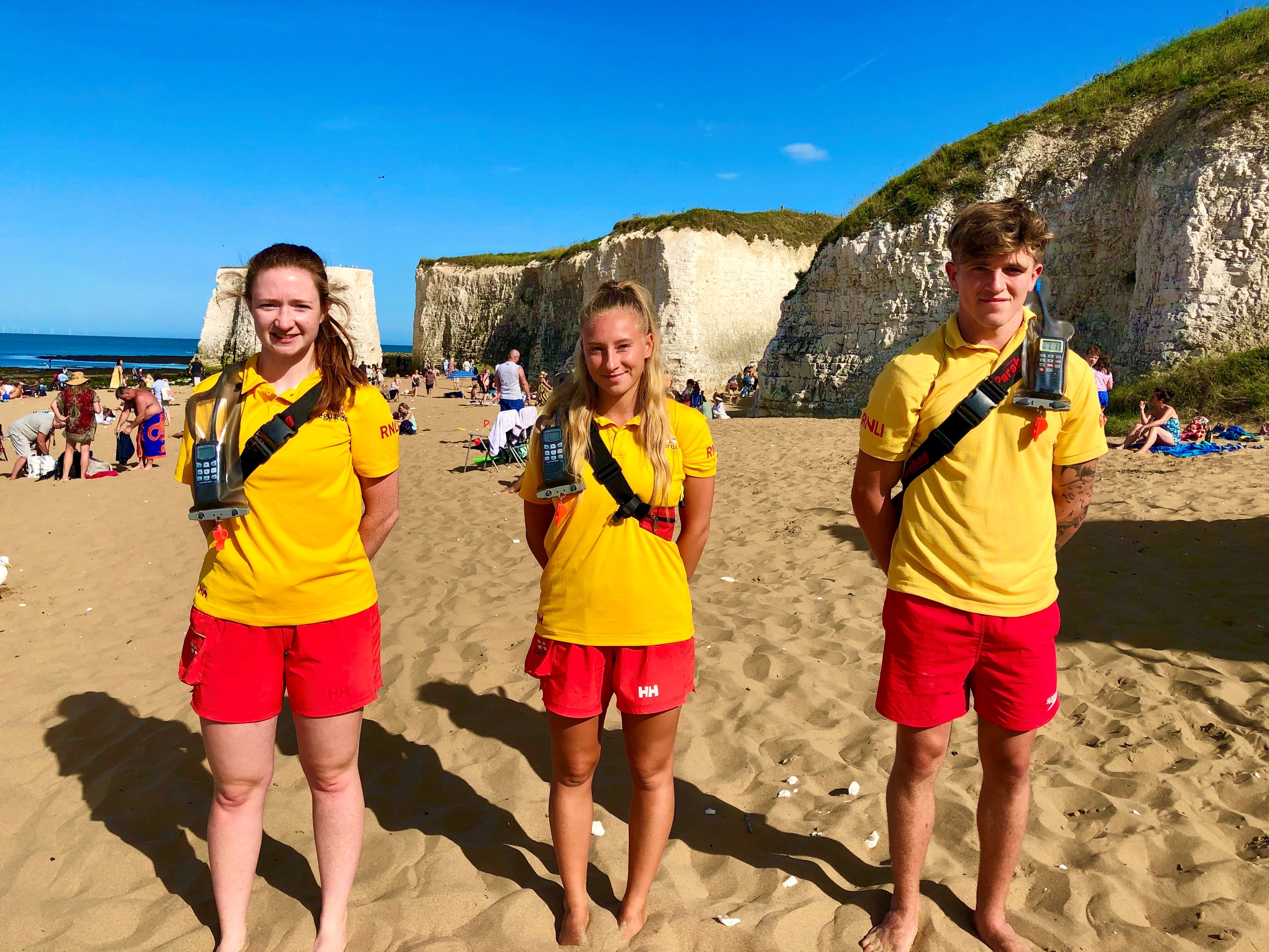 Left to right RNLI Lifeguard Amy Napier, Senior Lifeguard Ailsa MacRae and Lifegaurd Kane Philpott.