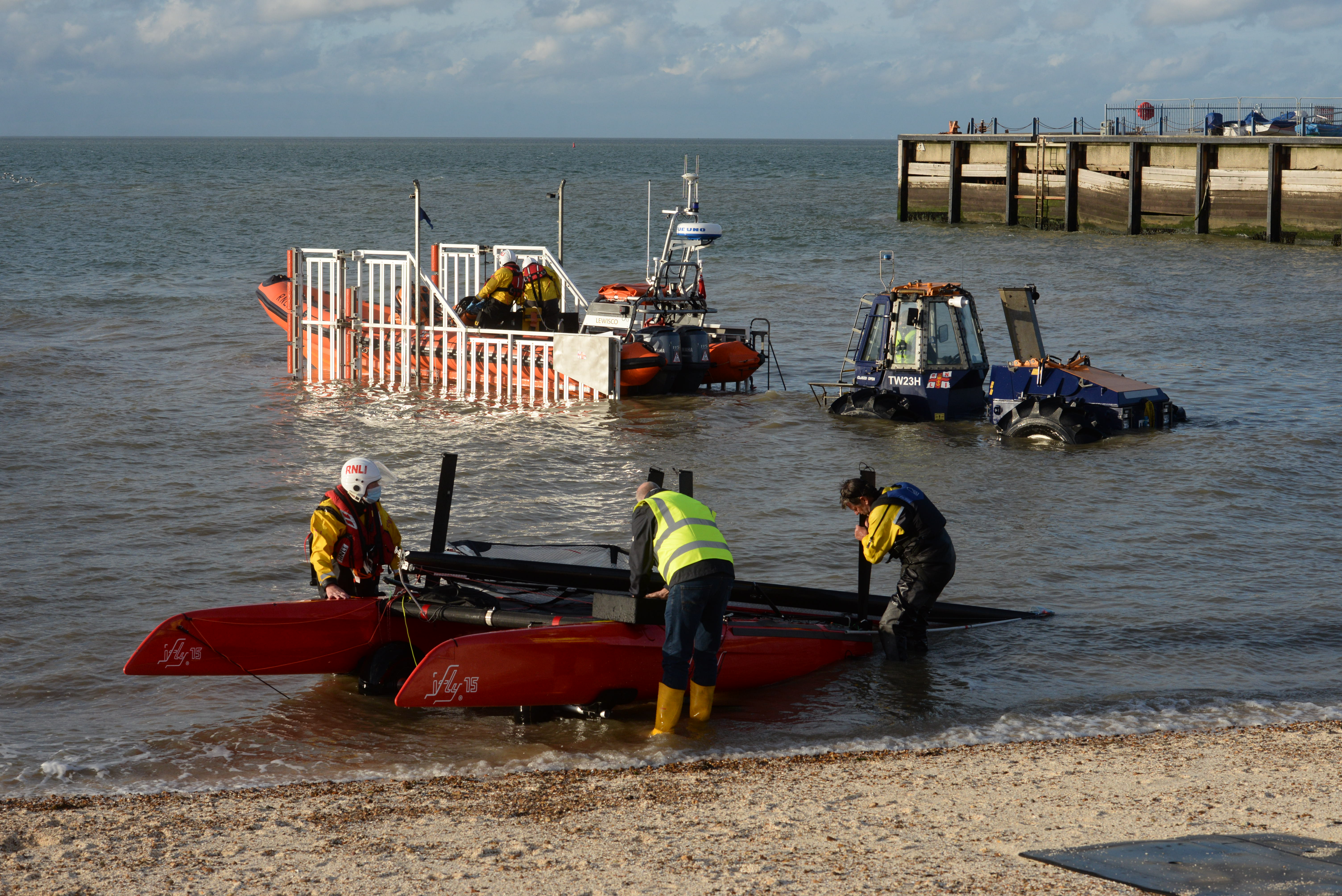 Whitstable's Atlantic 85 lifeboat Lewisco is recovered to its launching carriage after towing ashore a 15ft catamaran after the craft capsized off the town on Friday afternoon.