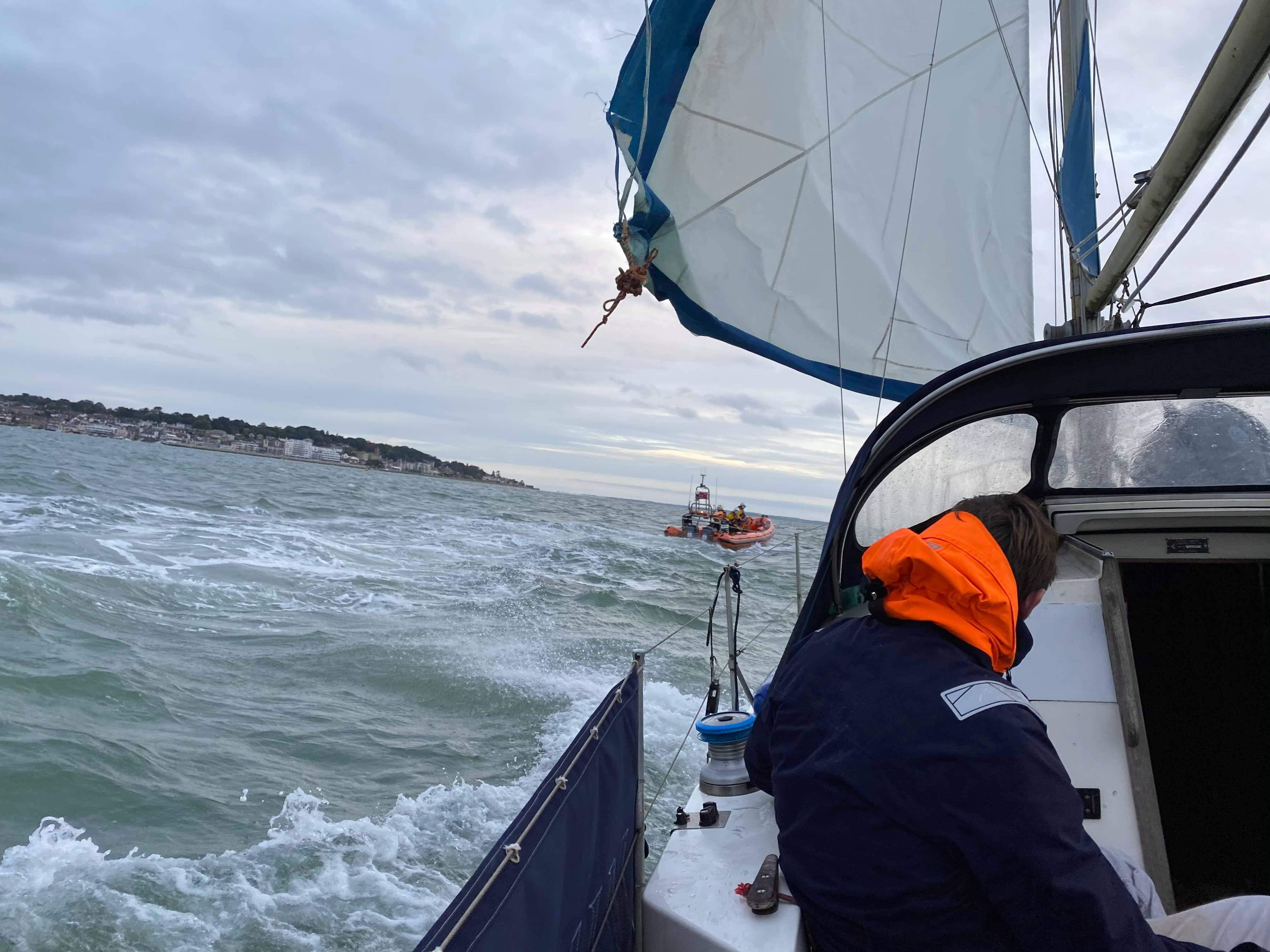 Photo taken from the yacht of th.e vessel being towed by the Cowes lifeboat.