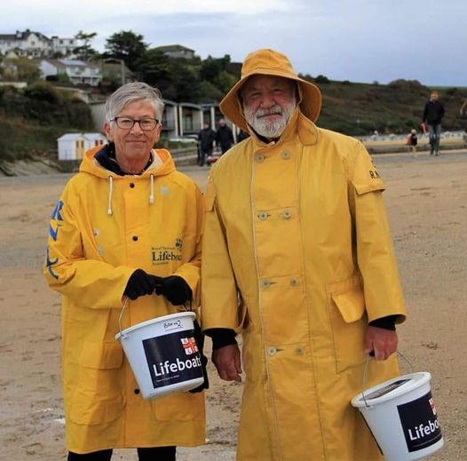 Norman and Janet, dressed in vintage lifeboat kit, collecting for the RNLI at on event on Porth Beach