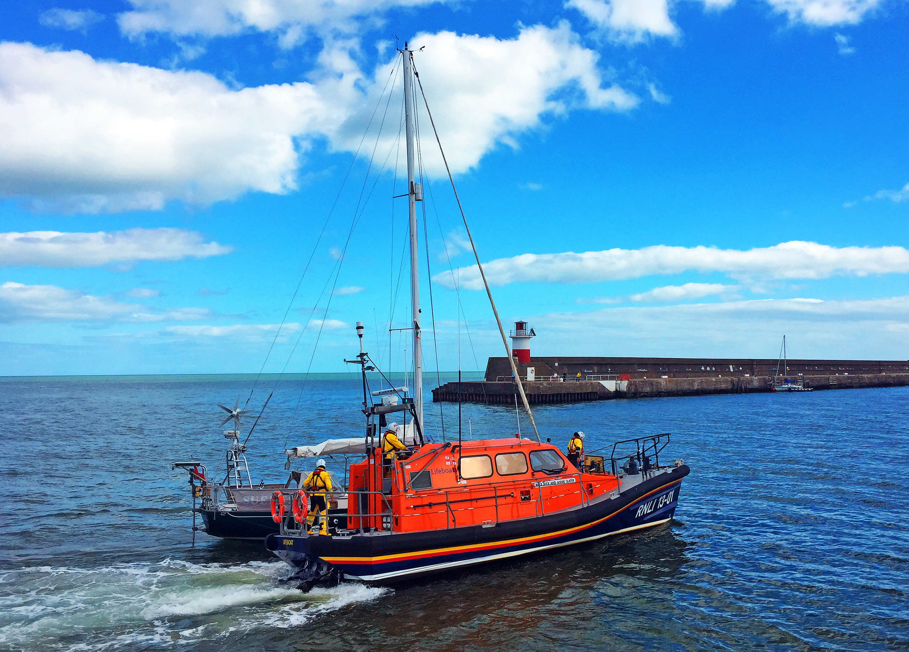 Wicklow Lifeboat towing the yacht into Wicklow harbour.
