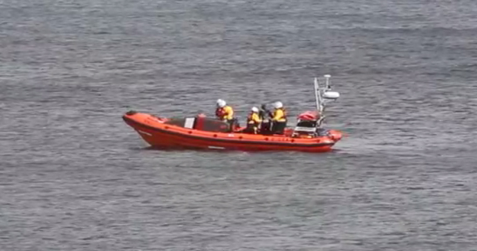 The casualty is checked over on the lifeboat