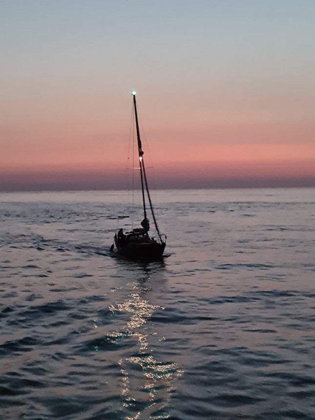Photo of the yacht taken from onboard the 'Esme Anderson' at sunrise.