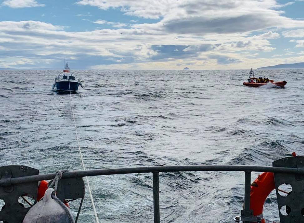 With the casualty vessel under tow, Arran lifeboat returns to Lamlash