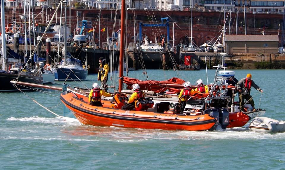 The inshore crew assisting a yacht to berth