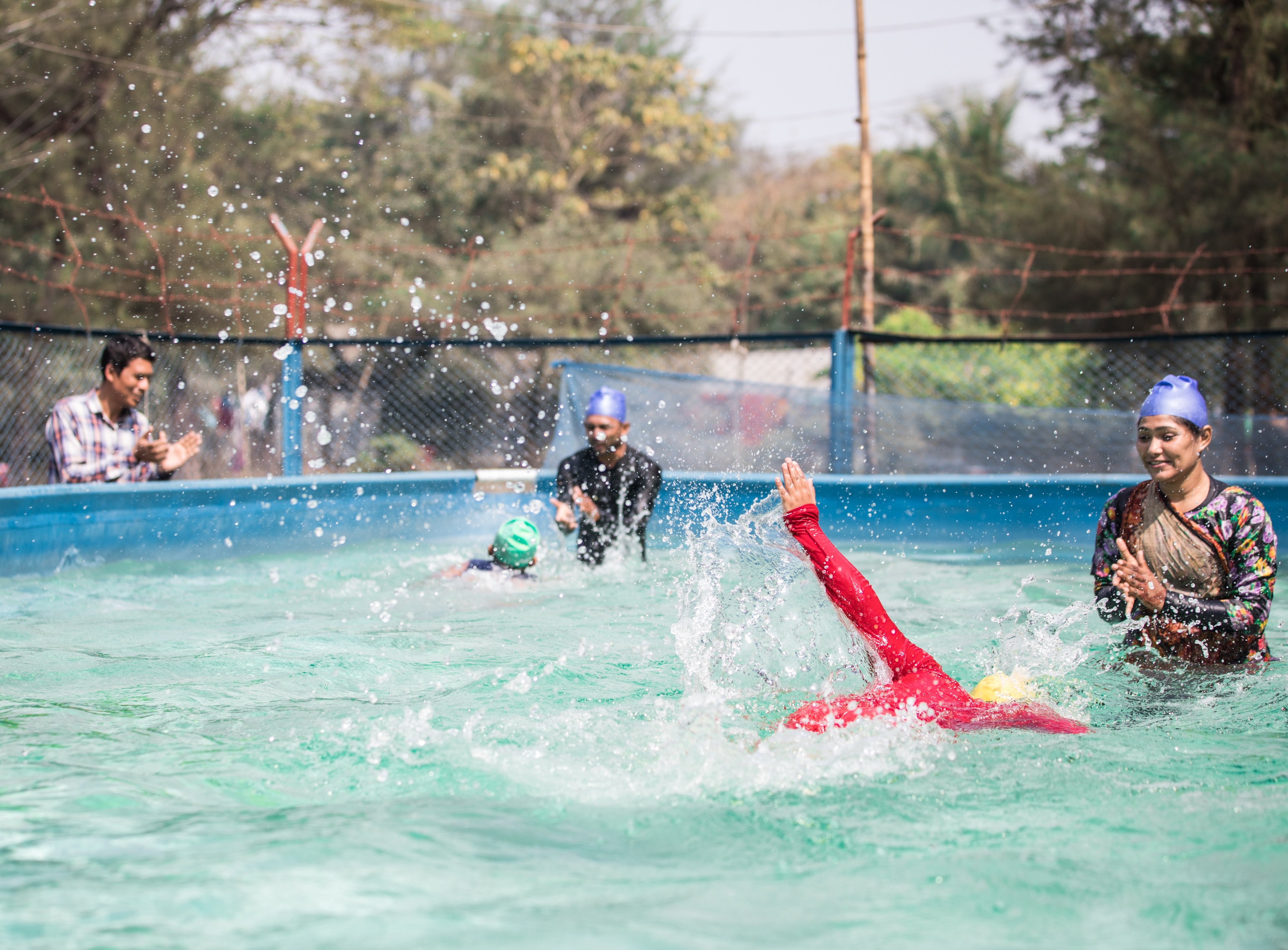 Children take part in survival swimming lessons in a portable pool in Cox’s Bazar, Bangladesh