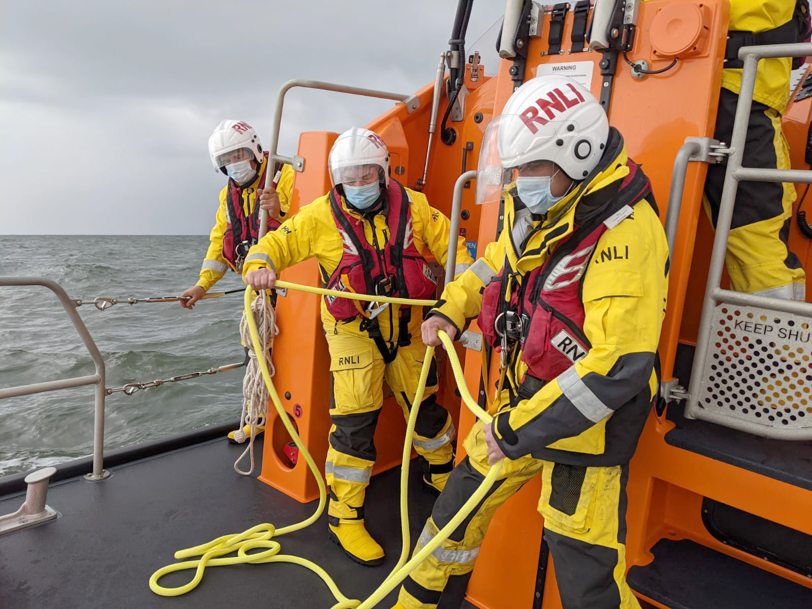 The lifeboat crew prepare the tow rope