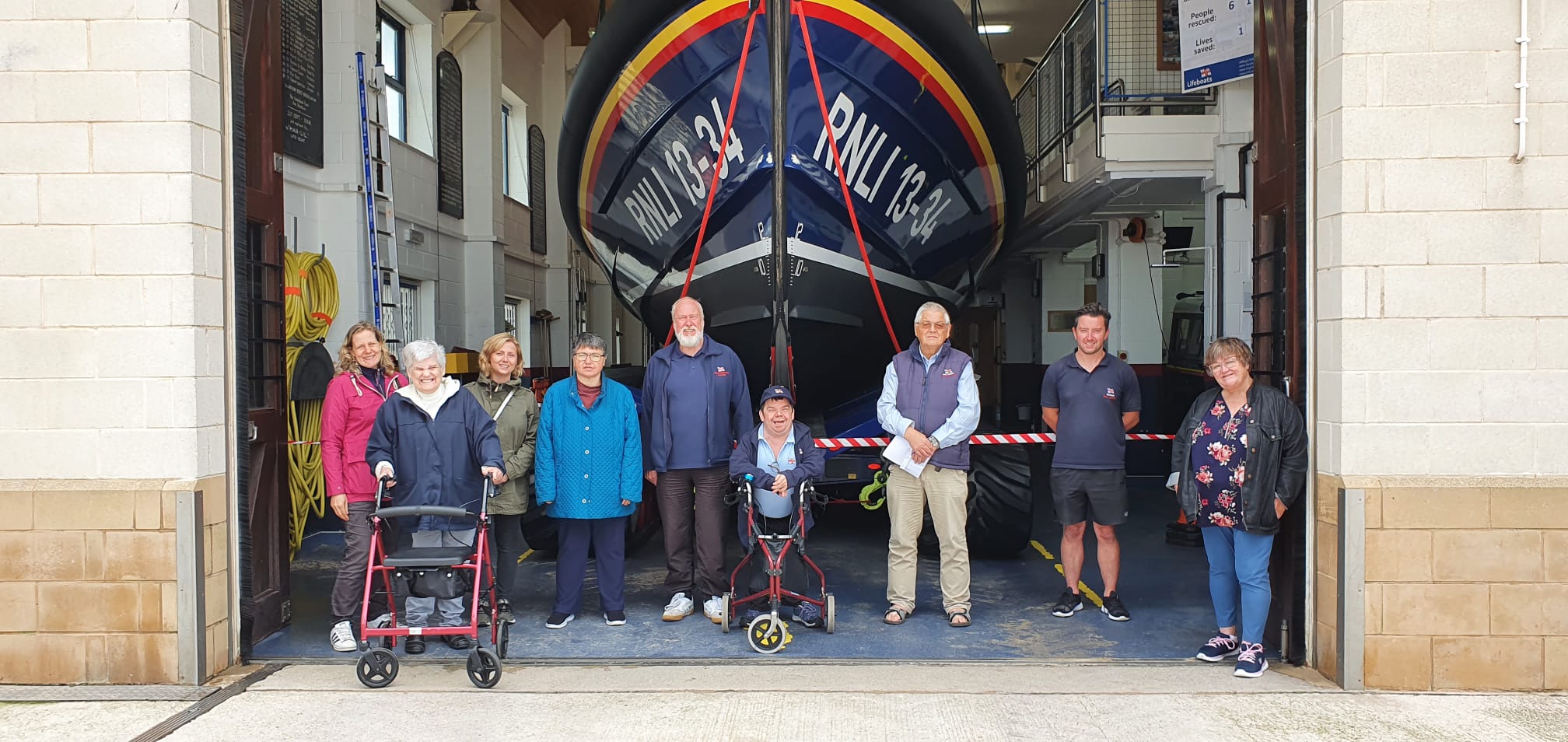 Peter (centre) outside Rhyl lifeboat station