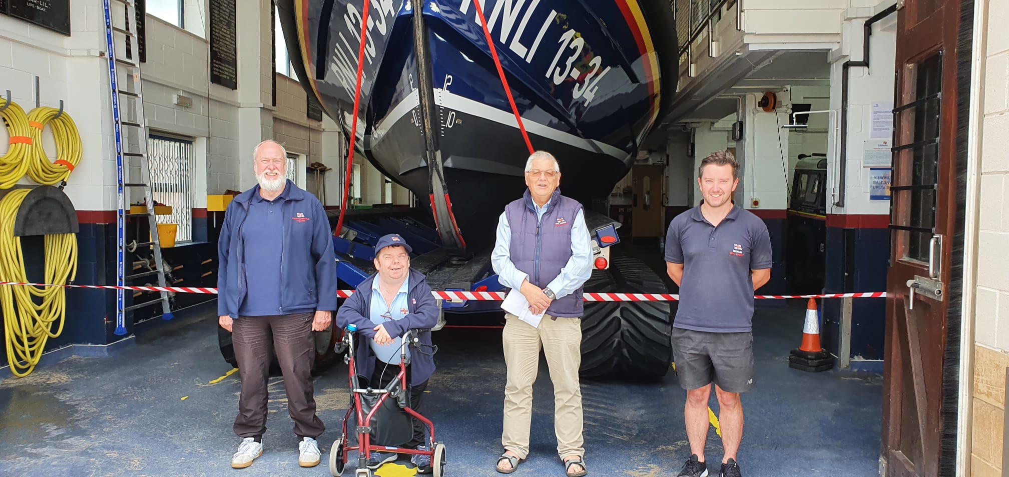 L-R Darrel Crowther (RNLI LOM), Peter, Peter Dean (fundraisers chair) and Callum Robinson (RNLI mechanic)