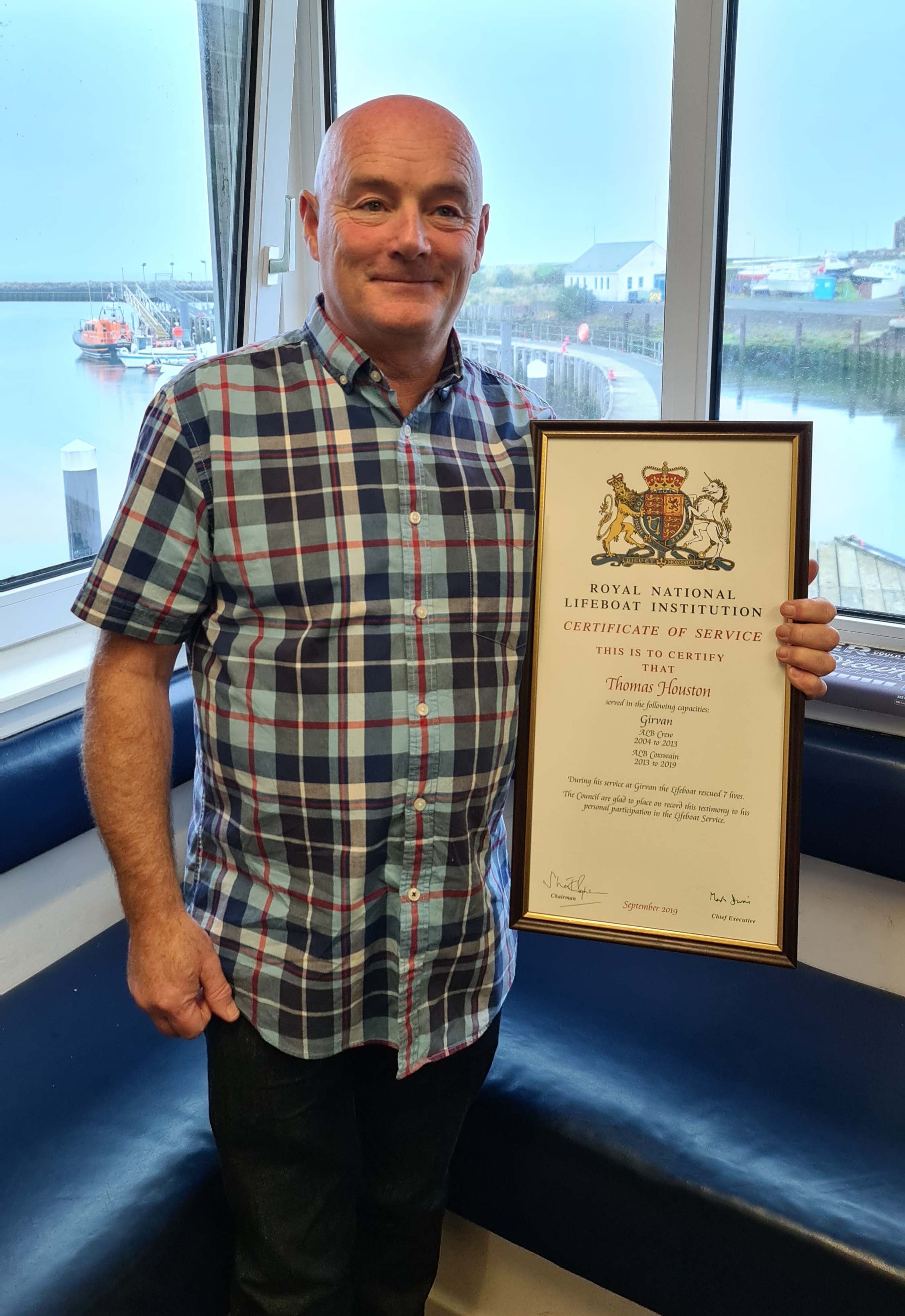 Girvan DLA with his vellum in recognition of his operational service during his time as a sea going crewmember/Coxwain