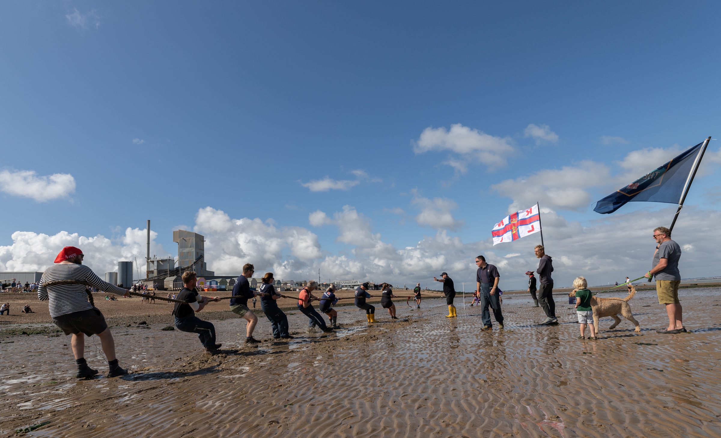 The scene as the Whitstable lifeboat team compete in the Oyster Festival 'Mud Tug'