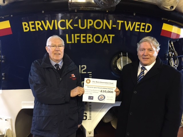 Deputy Launching Authority Michael Ross receiving cheque from the Mark Benevolment Fund