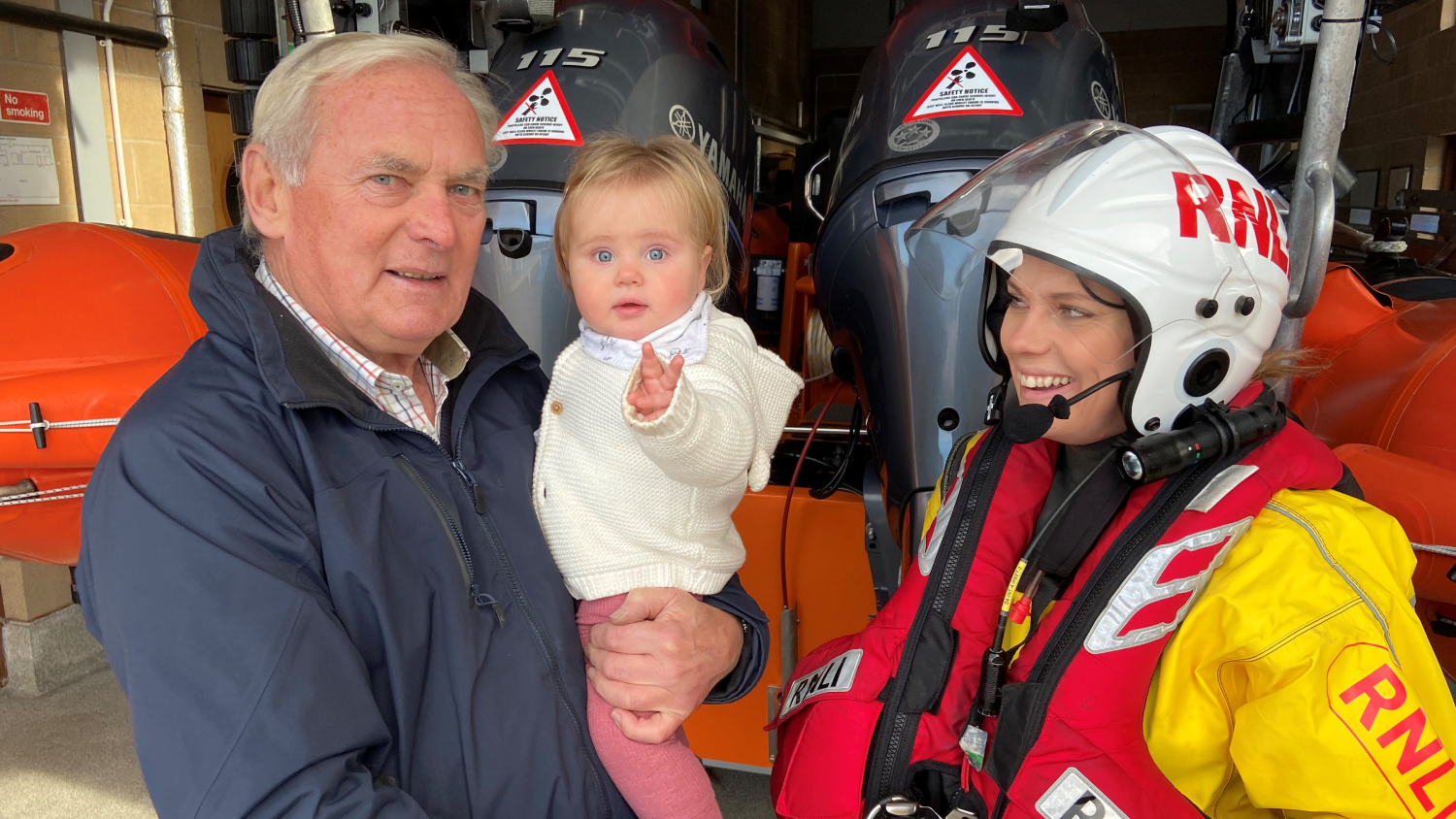 Bangor RNLI crew member Katherine Dunlop pictured with her father Myles Lindsay and her daughter Isla
