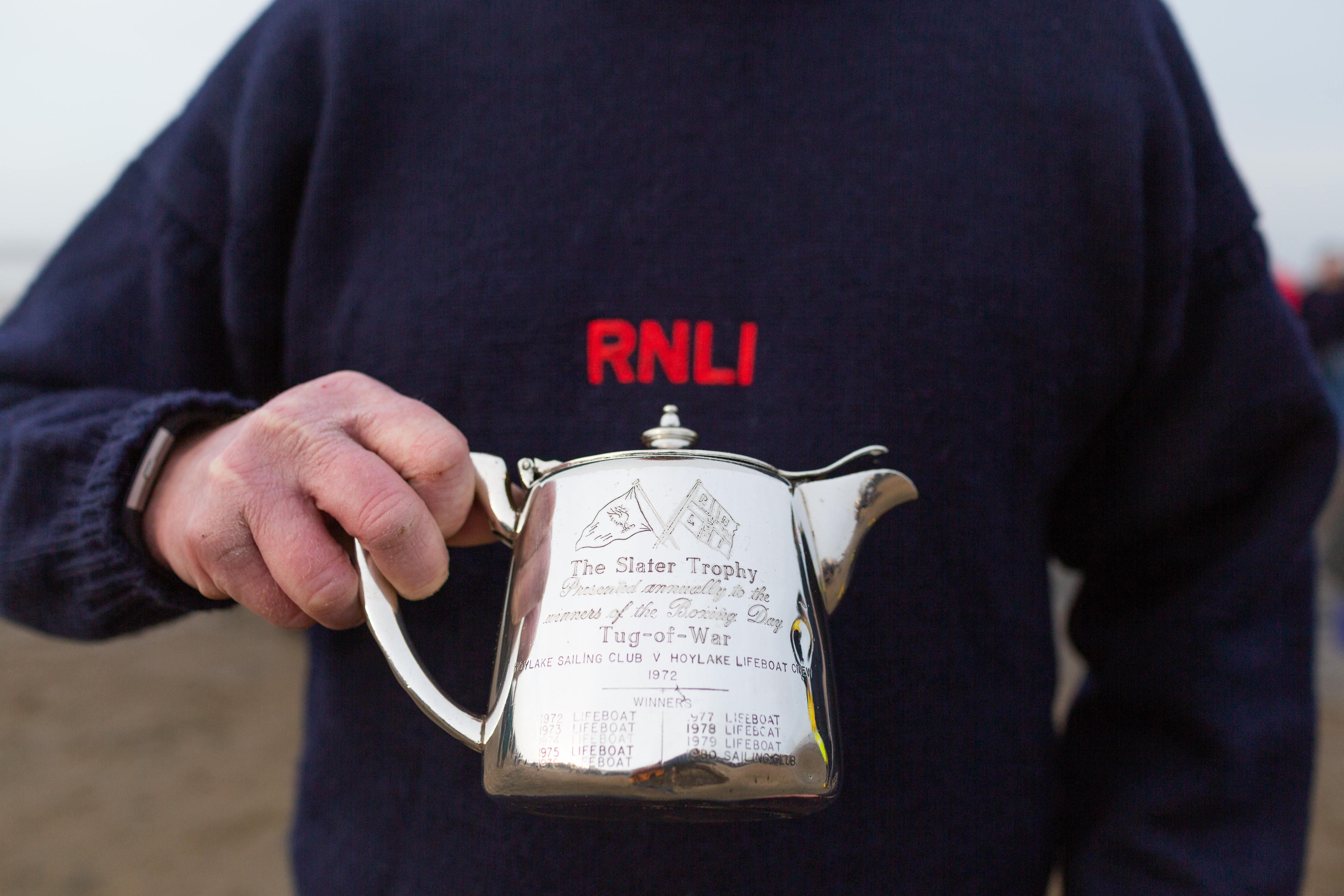 The Slater Trophy - a small teapot - bears the names of the winning Tug o’War team since 1972
