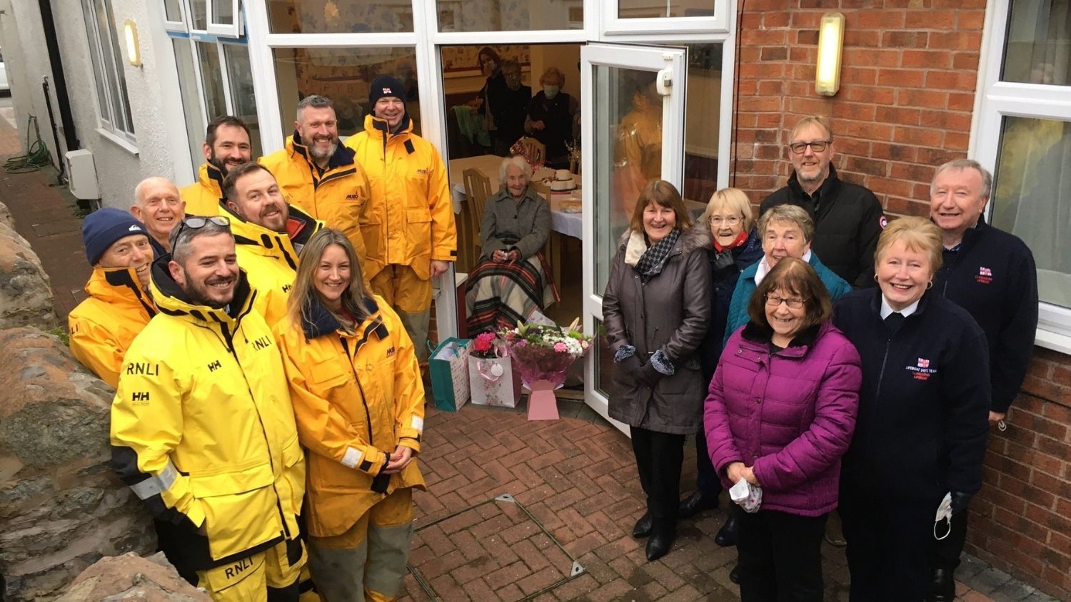 Lifeboat Volunteer Edith Bellamy celebrated her 100th birthday with volunteers from Llandudno