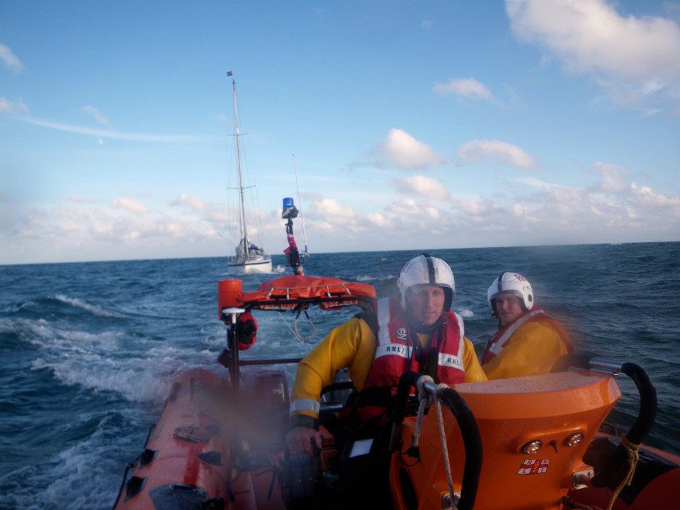 Andy Harris at the helm of the Blue Peter 1 towing a yacht back to harbour (June 2012).
