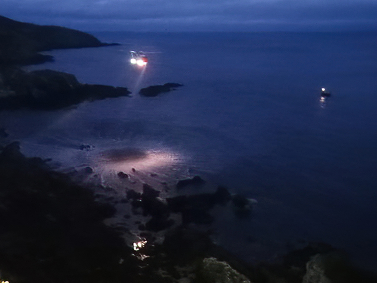 Lifeboat on standby CG helicopter arriving on scene