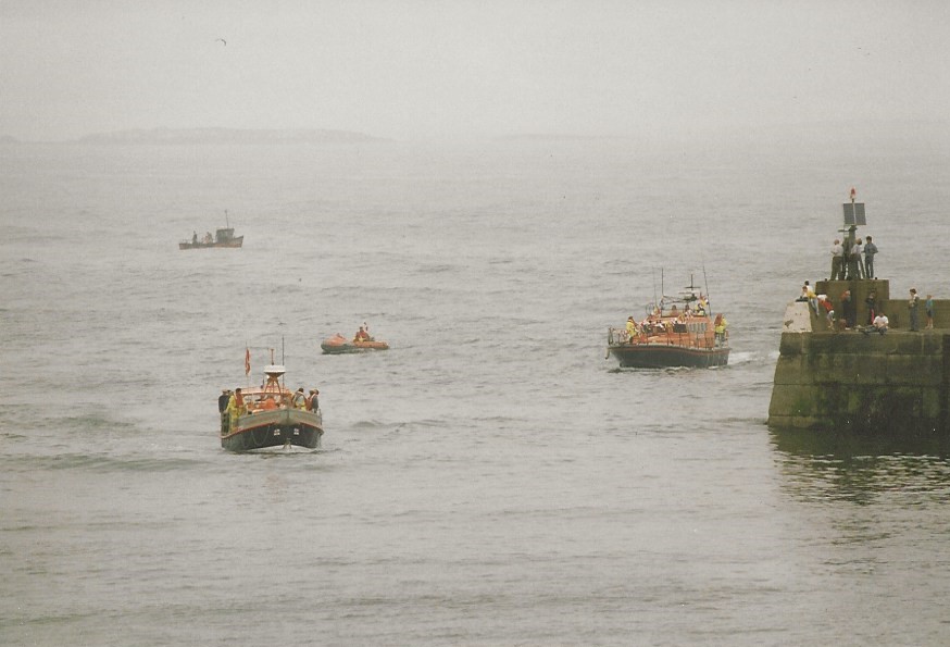 RNLB 12-16 Grace Darling being escorted into Seahouses in 1991