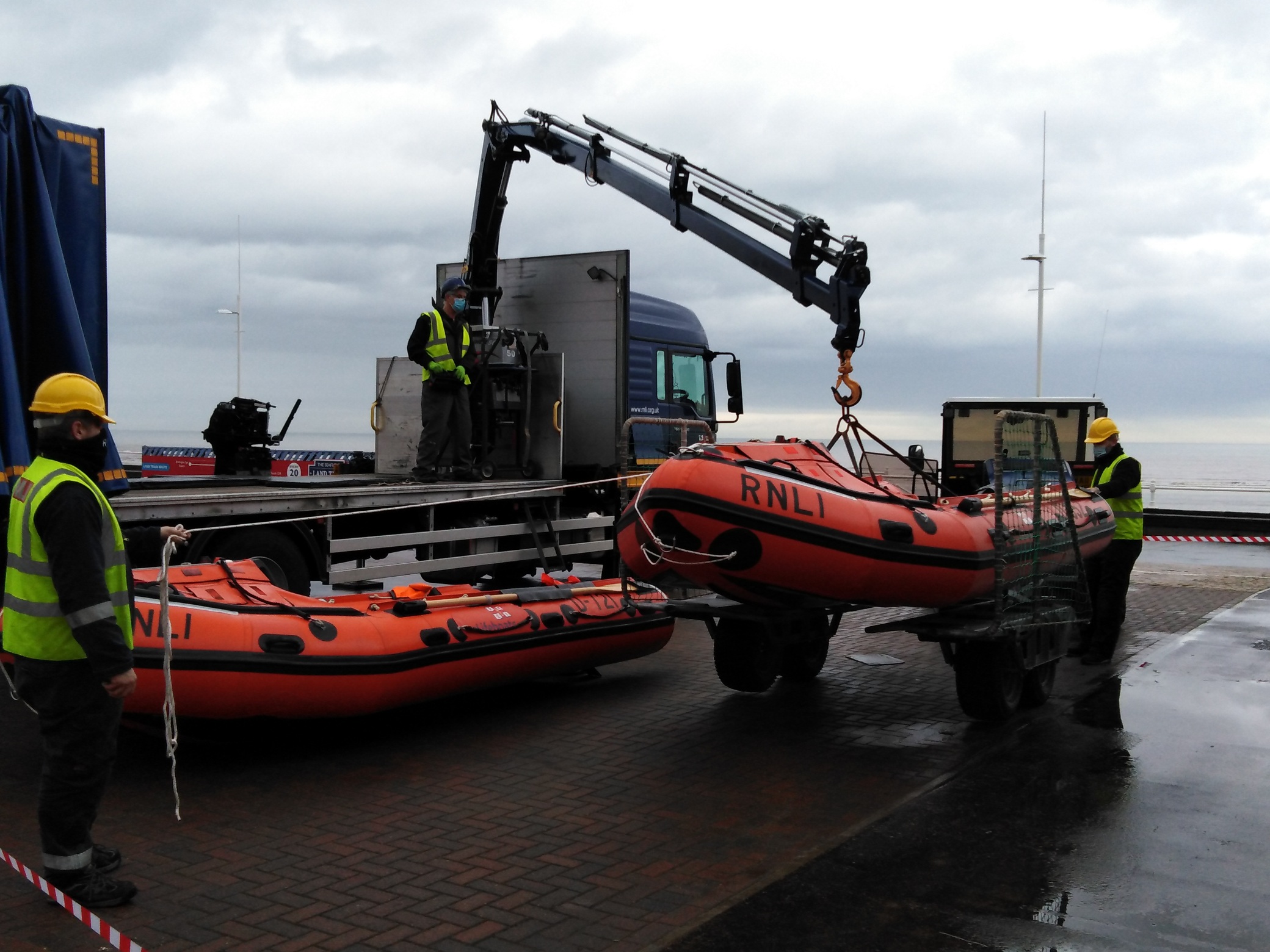 The new inshore lifeboat is safely on the trailer ready to be detached from the lorry that transported it.