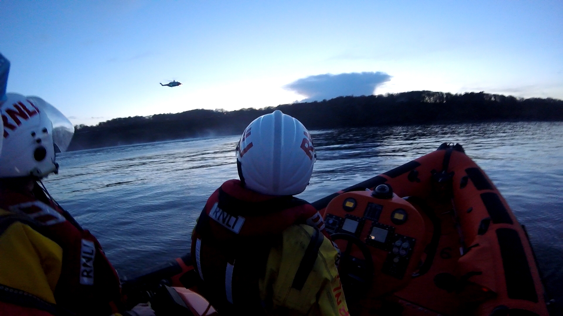 Skerries RNLI volunteers watch as Rescue 116 prepares to winch the casualties