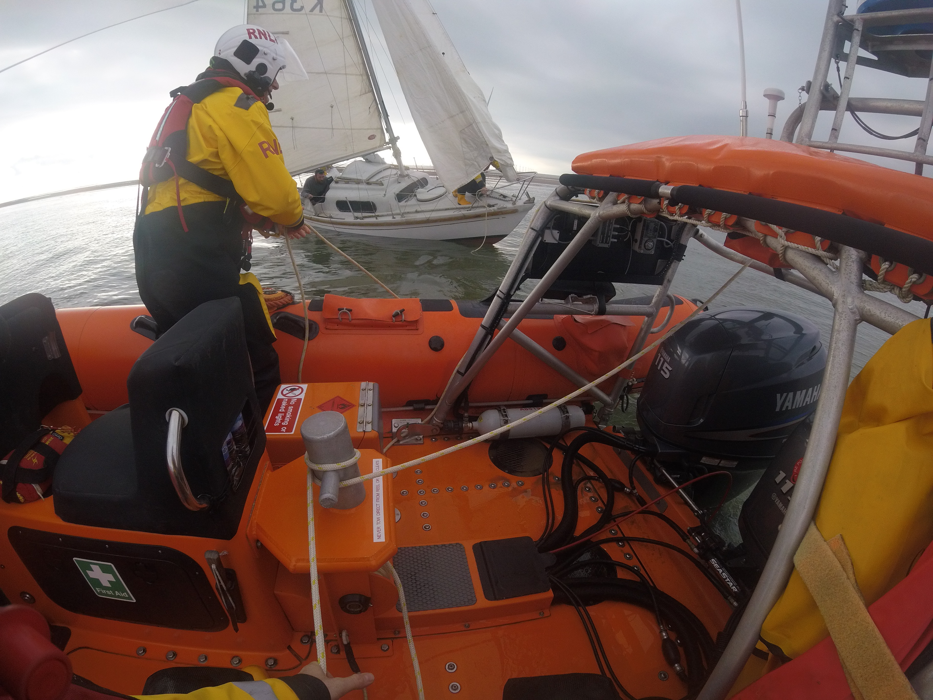 Clacton RNLI ILB alongside vessel that had run aground