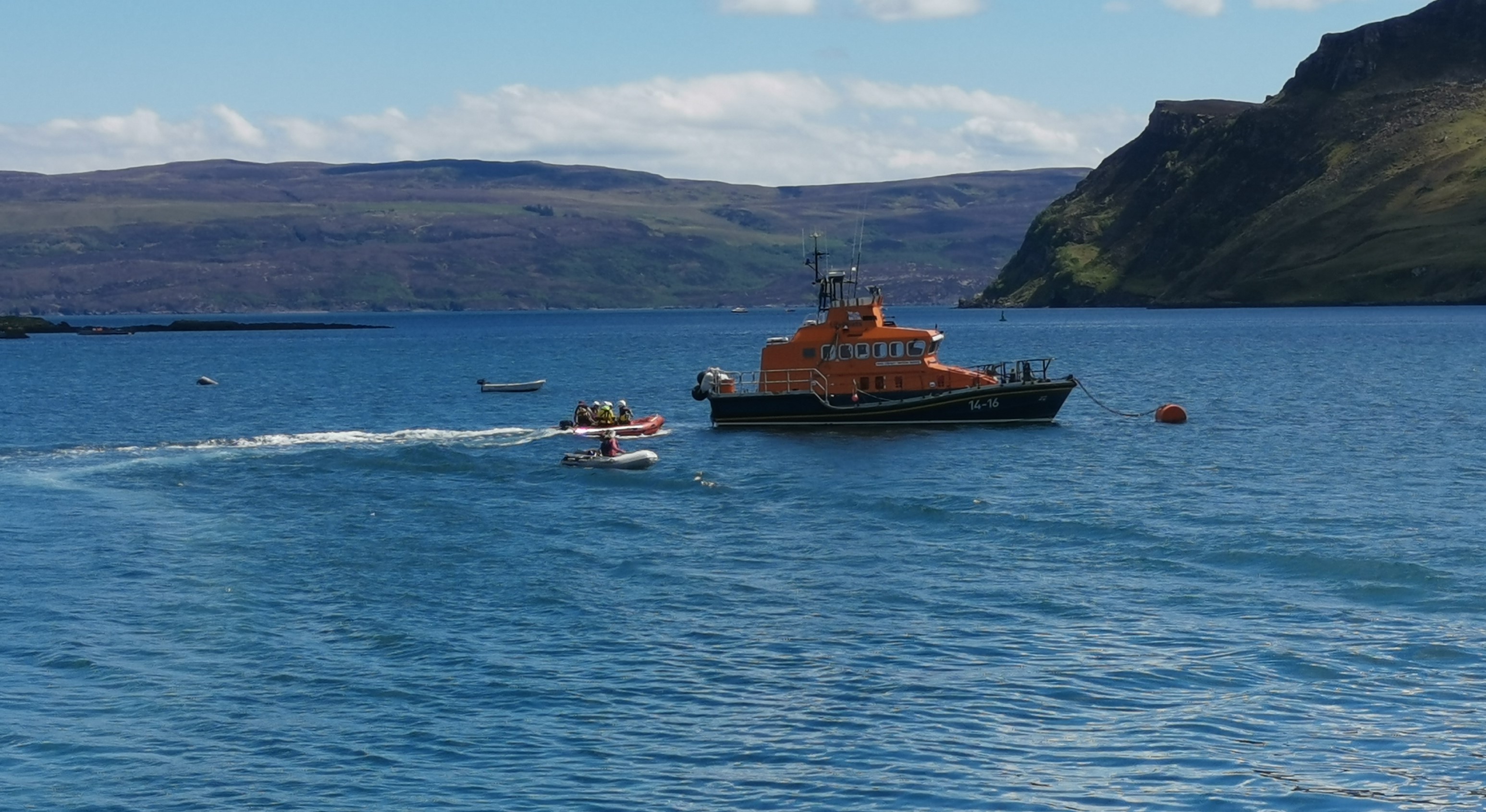 Portree All Weather Lifeboat and Boarding boat being tasked to assist Scottish Ambulance Service at the Scorrybreac Walk, Portree.