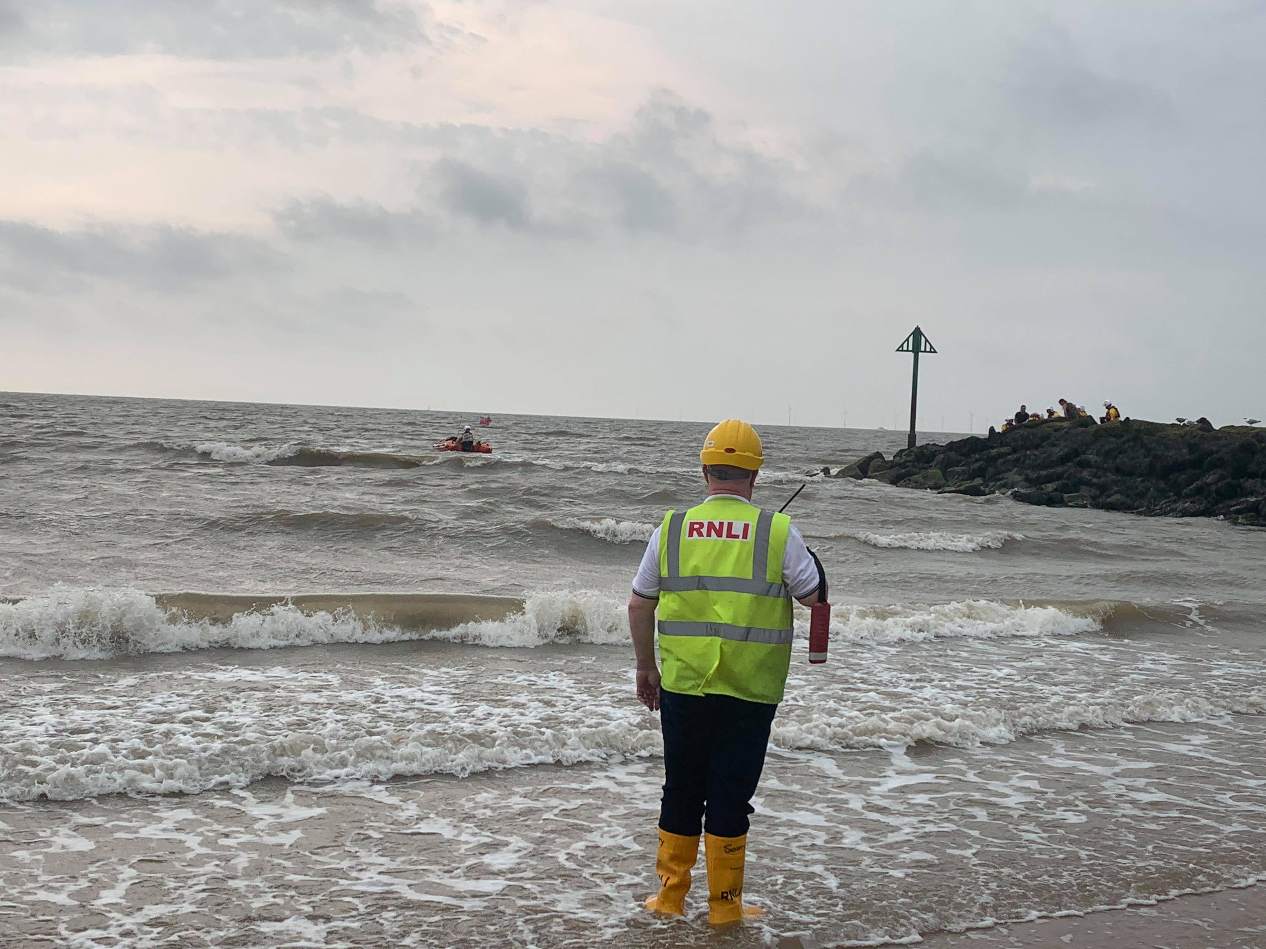 Shore crew and crew afloat work closely in rescue of casualty from rocks