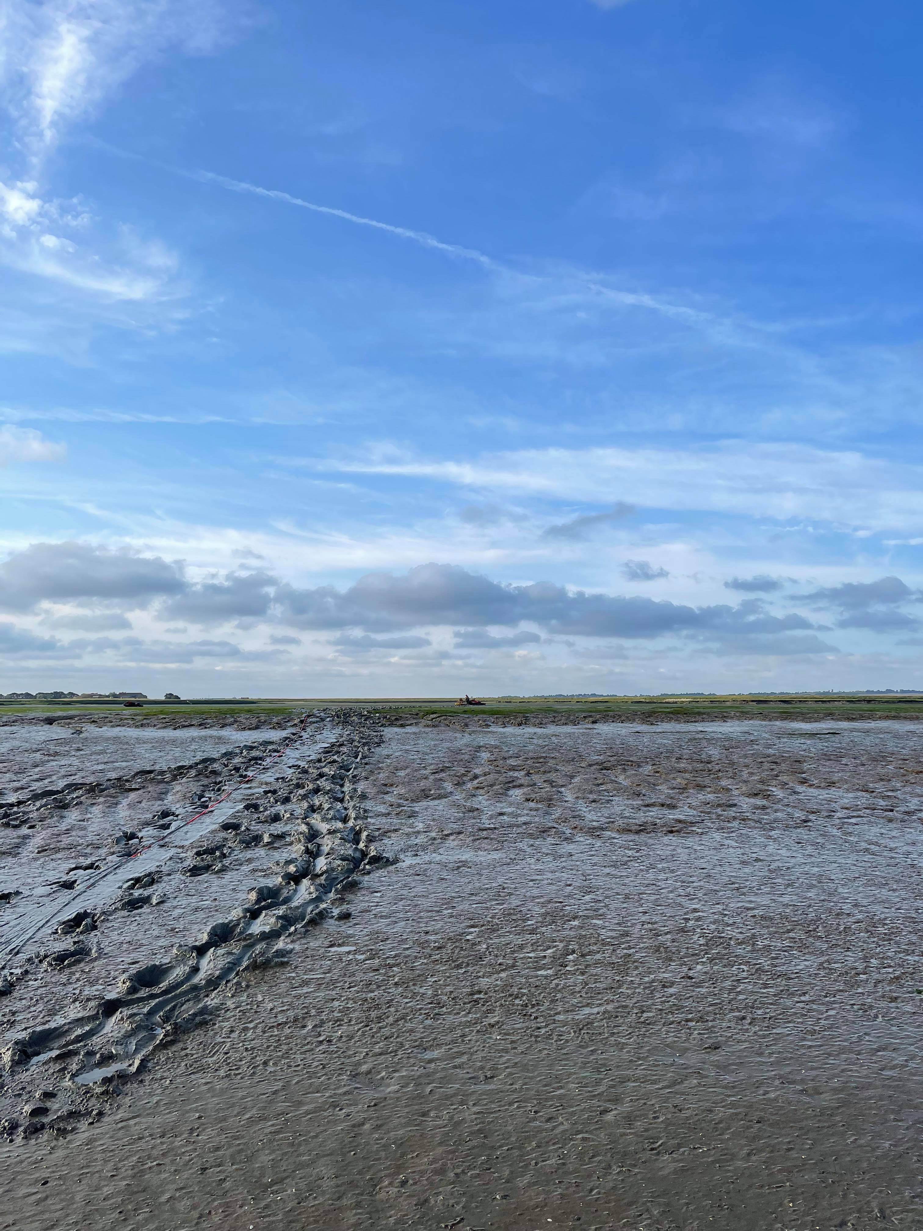 The view from the lifeboat across the mud to the little speck in the distance which is the nearest Jet Ski