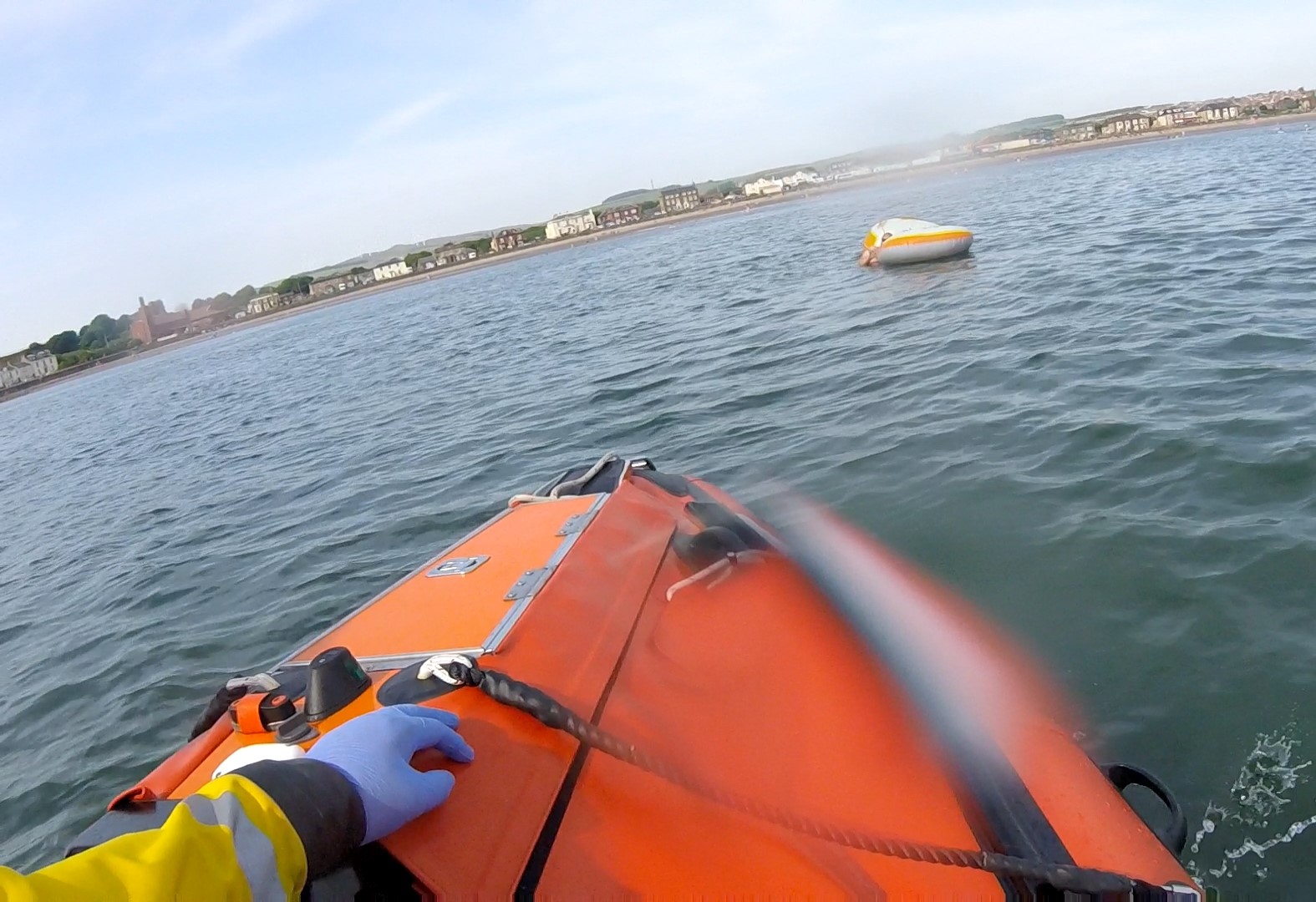 Troon RNLI inshore lifeboat assisting with an inflatable