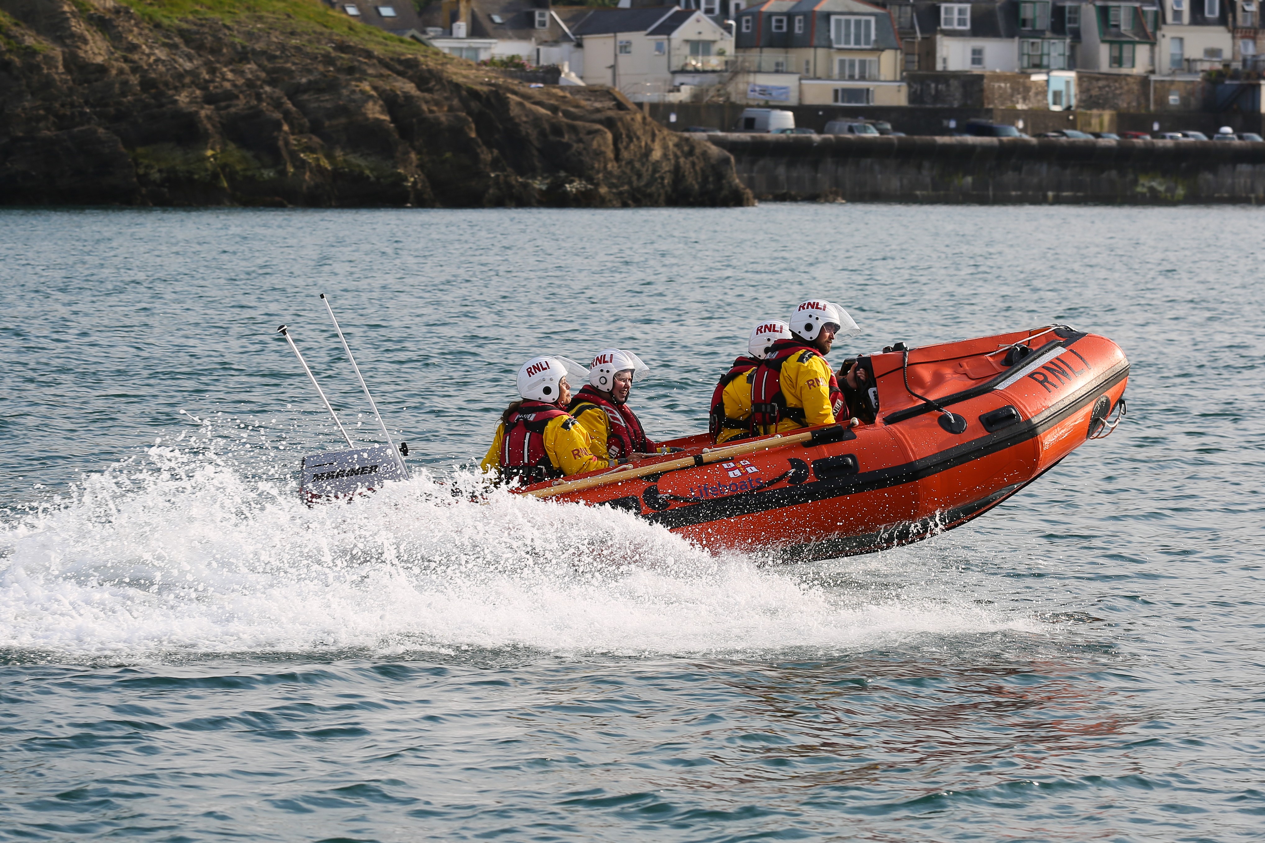Ilfracombe RNLI D class inshore lifeboat heading out to sea