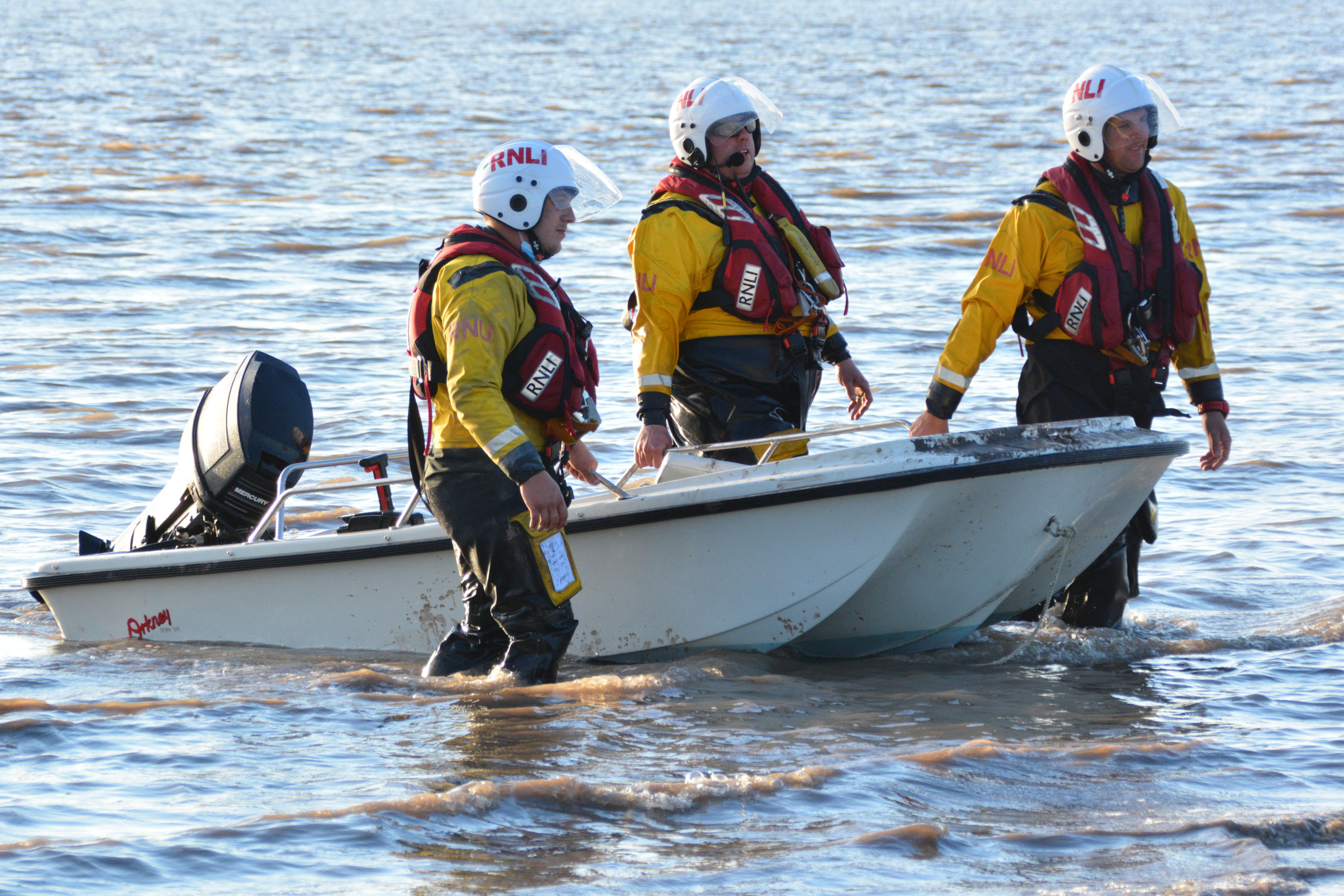 Burnham-on-Sea crew members assist in recovery of the casualty to the beach