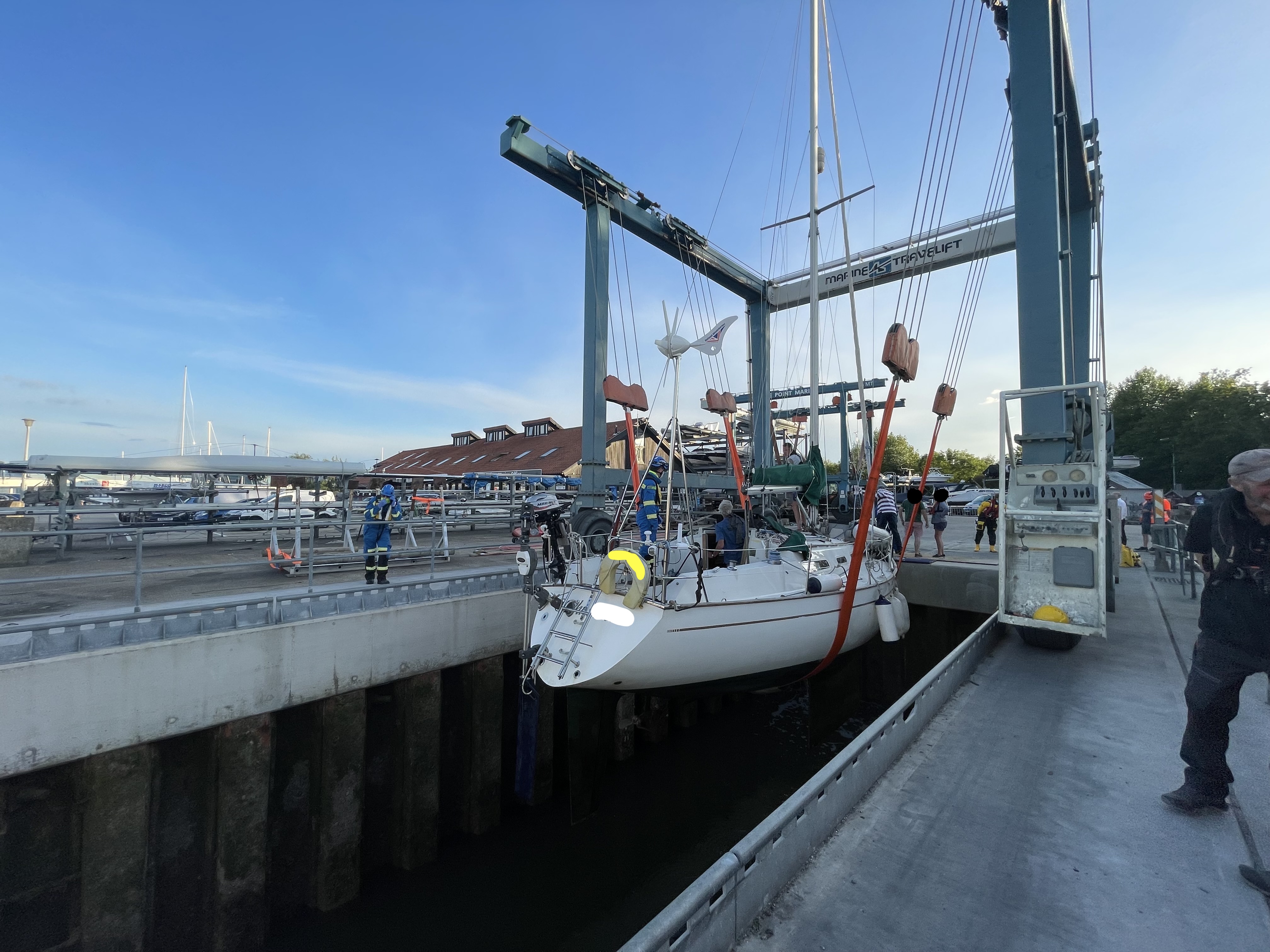 Yacht shown having been lifted out of the water at the marina.