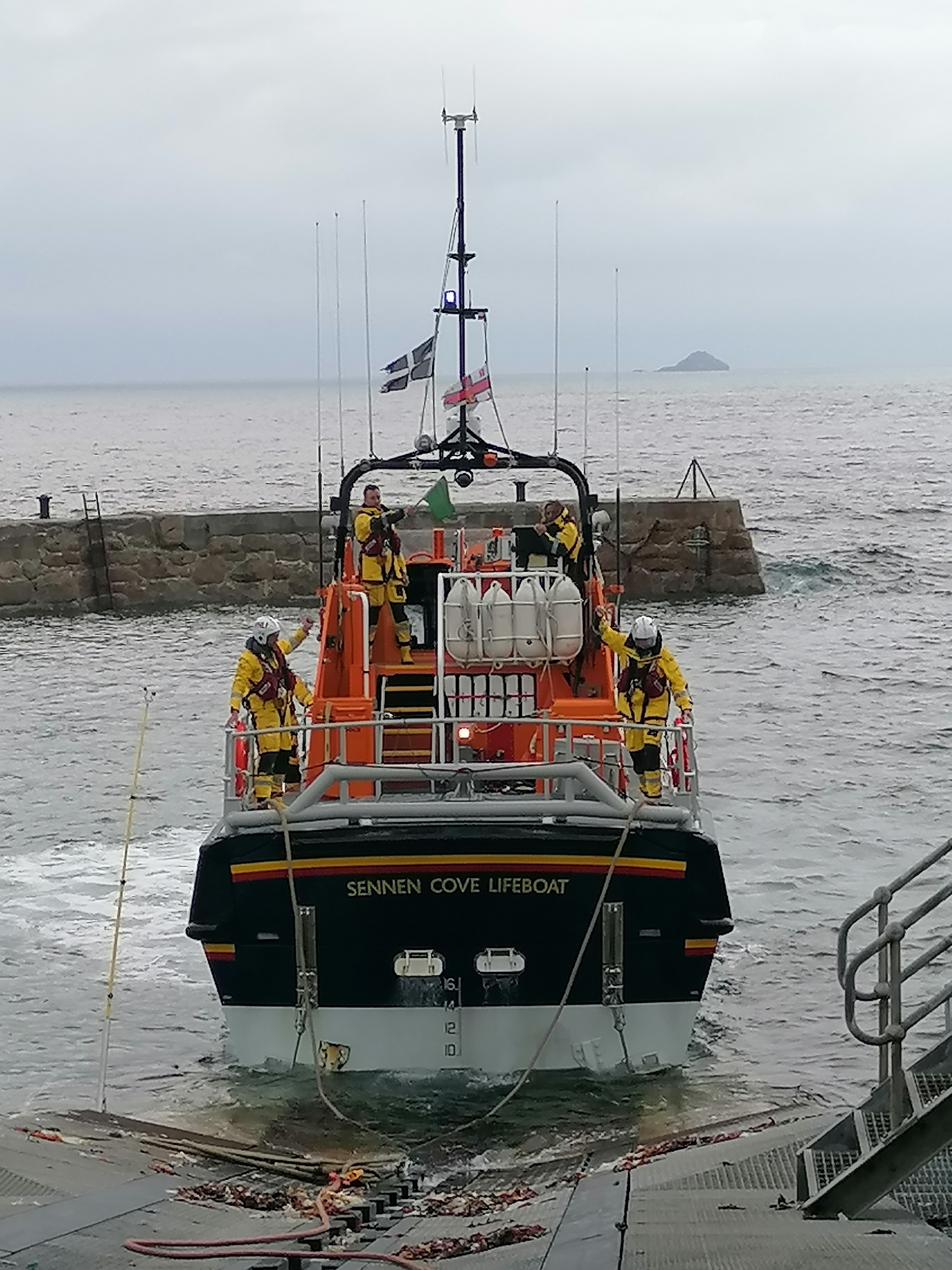Sennen Cove Tamar class lifeboat recovering on the short slip at high tide 