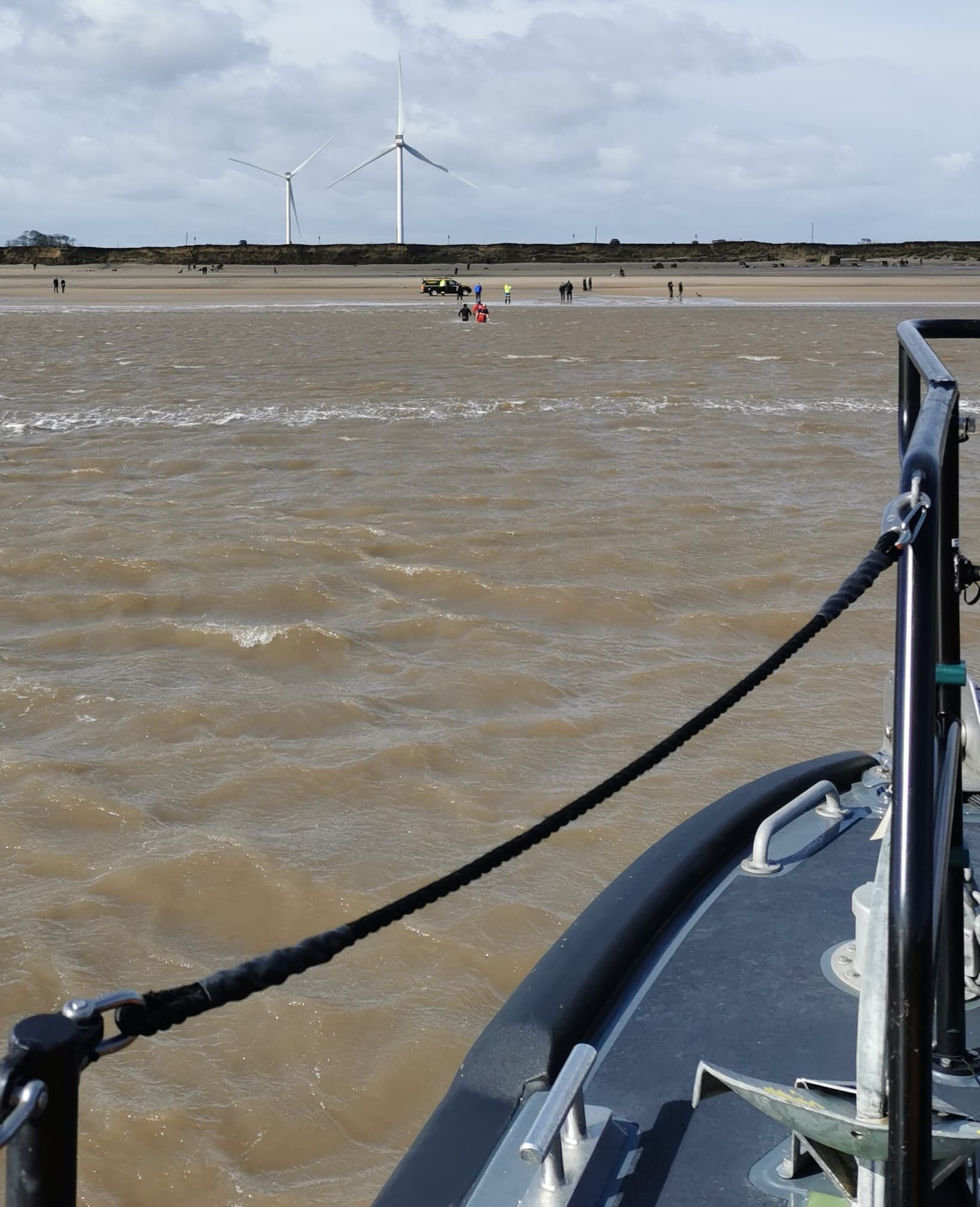 A Coastguard team in the water, taken from aboard the all-weather lifeboat