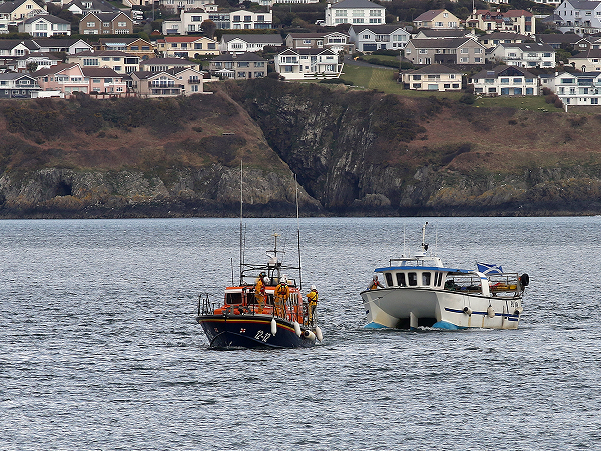 Casualty vessel under tow by Douglas all-weather lifeboat, Marine Engineer.