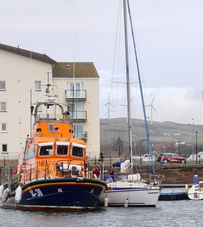 Troon RNLI all-weather lifeboat and the casualty vessel in Ardrossan harbour