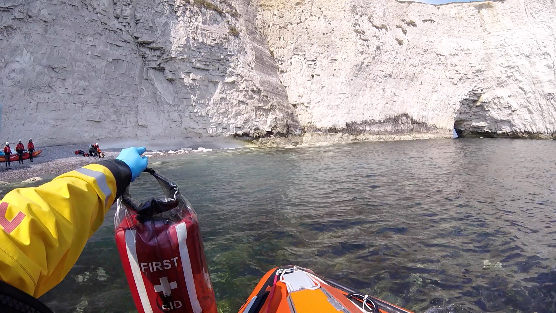 Swanage RNLI volunteer lifeboat crew arriving on scene.