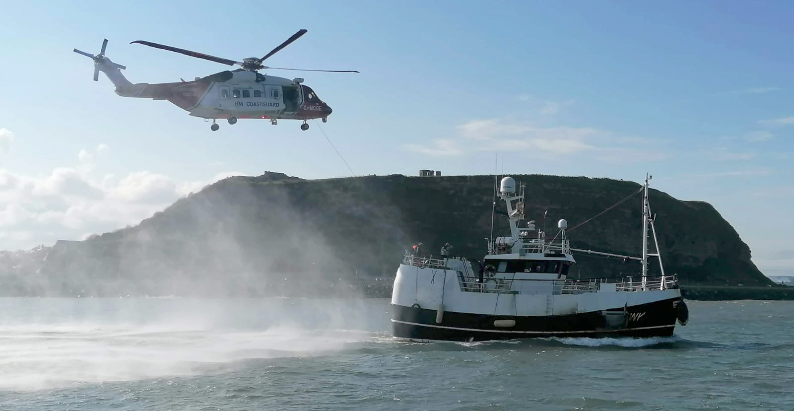 The coastguard helicopter and the fishing boat