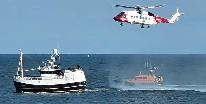 The lifeboat, coastguard helicopter and fishing boat
