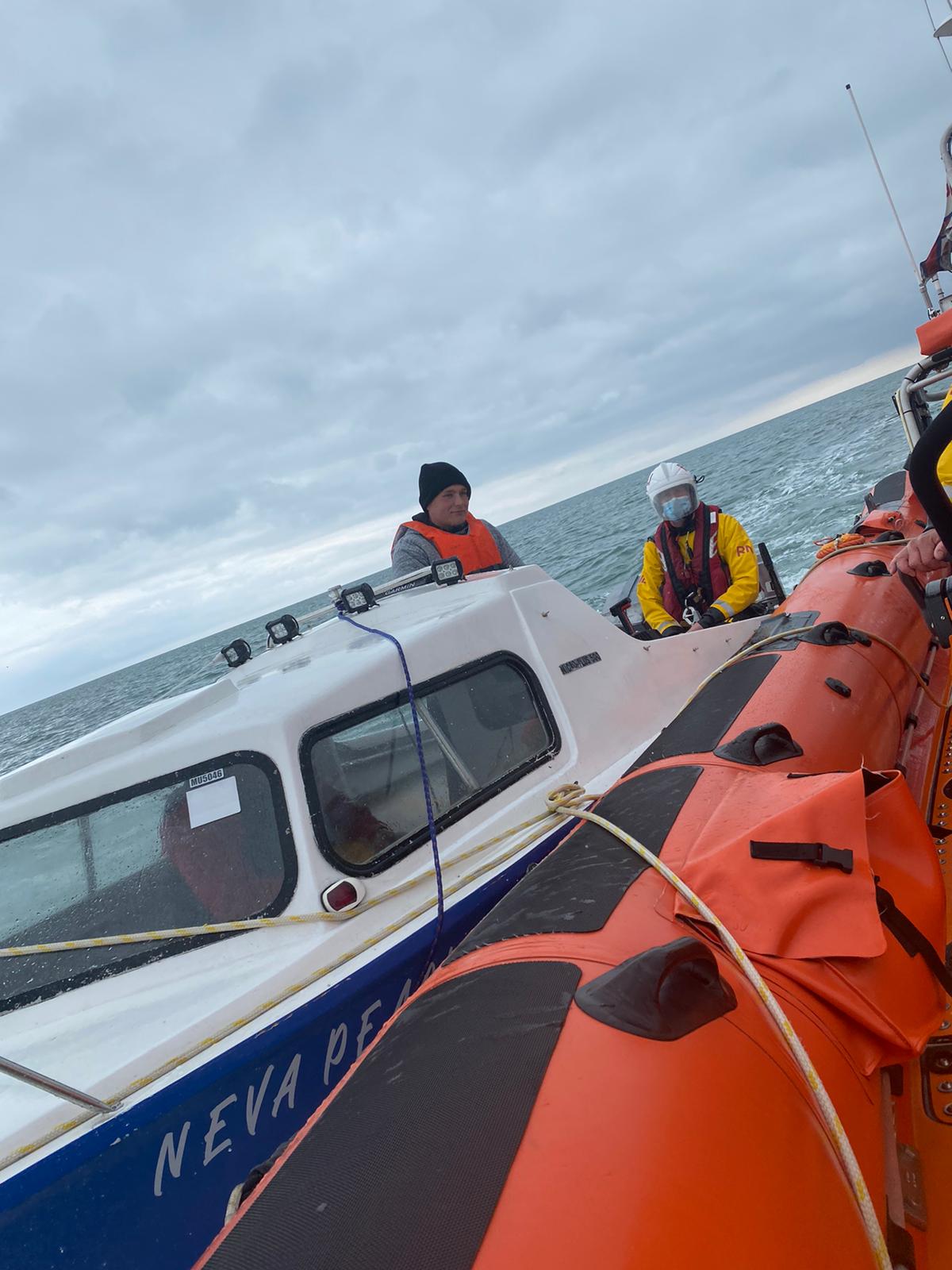 The Neva Pearl alongside the lifeboat as the tow is prepared