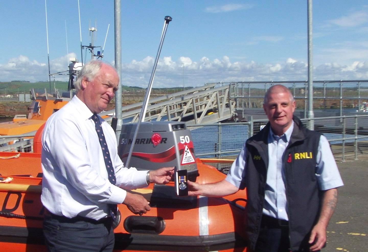 Troon lifeboat Coxswain Joe Millar receiving his 30 year medal.