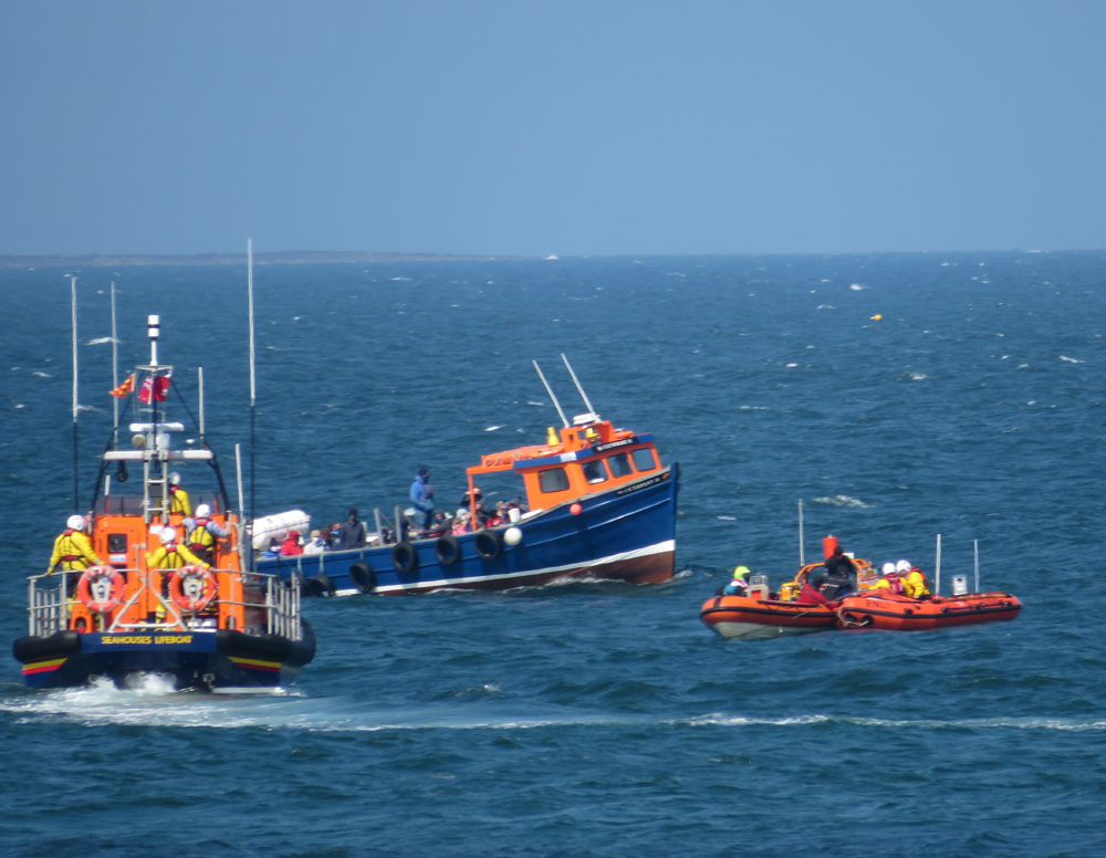 Seahouses Lifeboats with the casualty vessel. Local passenger boat come to look !