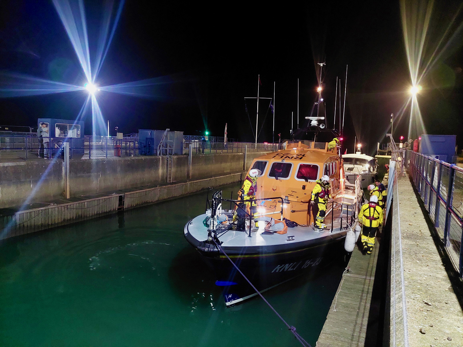 Photo of the RNLI lifeboat and casualty vessel in the locks