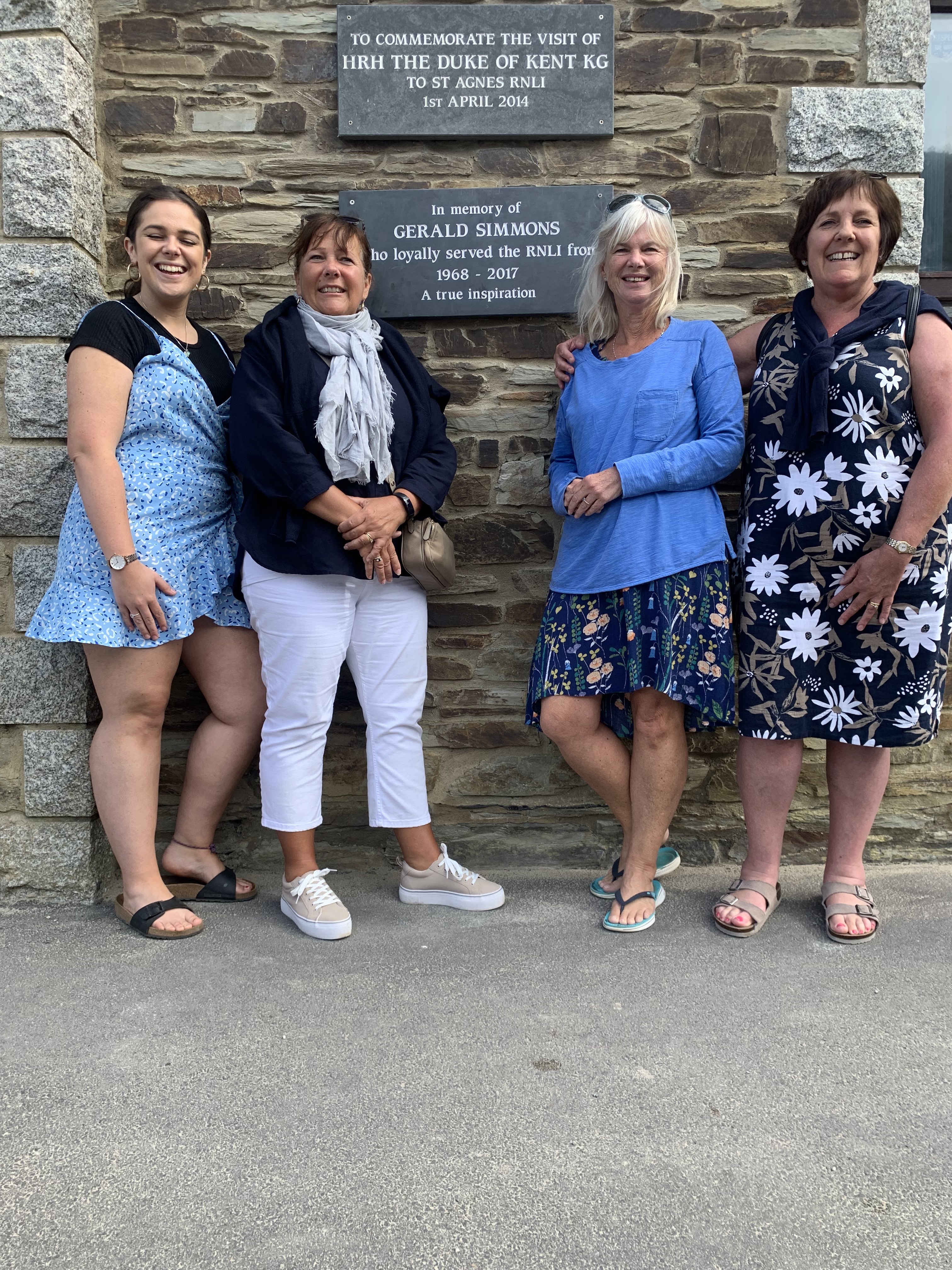From left to right. Gerald's daughters Libby, Philippa, his partner Debbie and his daughter Lisa standing in front of the plaque