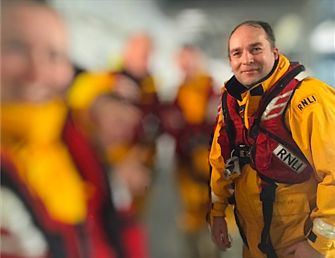 Chris in RNLI gear smiling into the camera