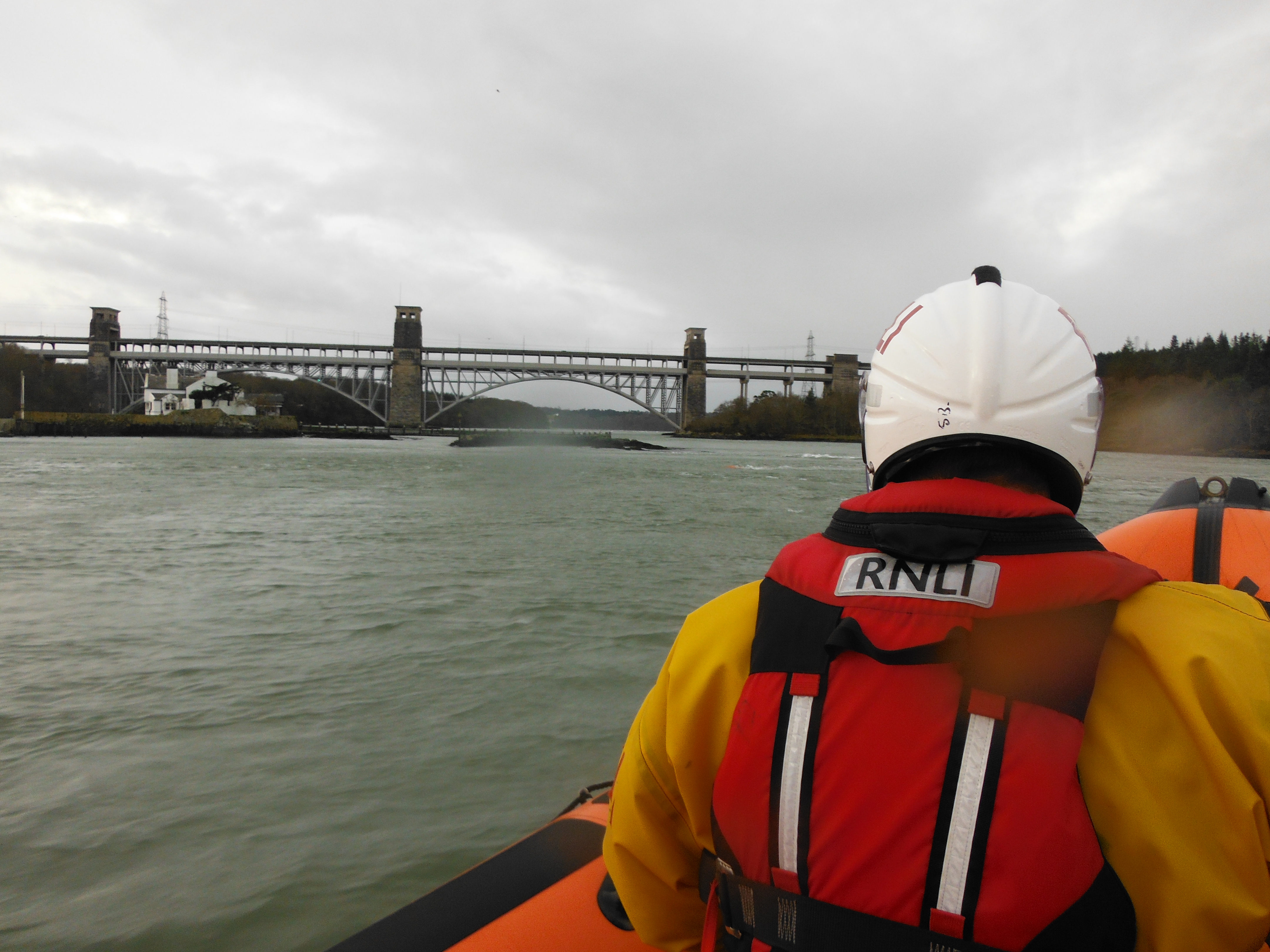 Beaumaris Lifeboat approaching the Britannia Bridge over the Menai Strait