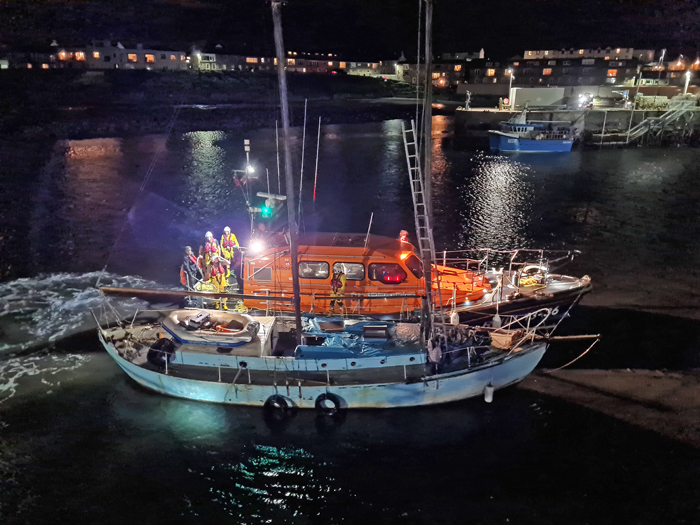 Seahouses Lifeboat and casualty schooner alongside, enter Seahouses Harbour