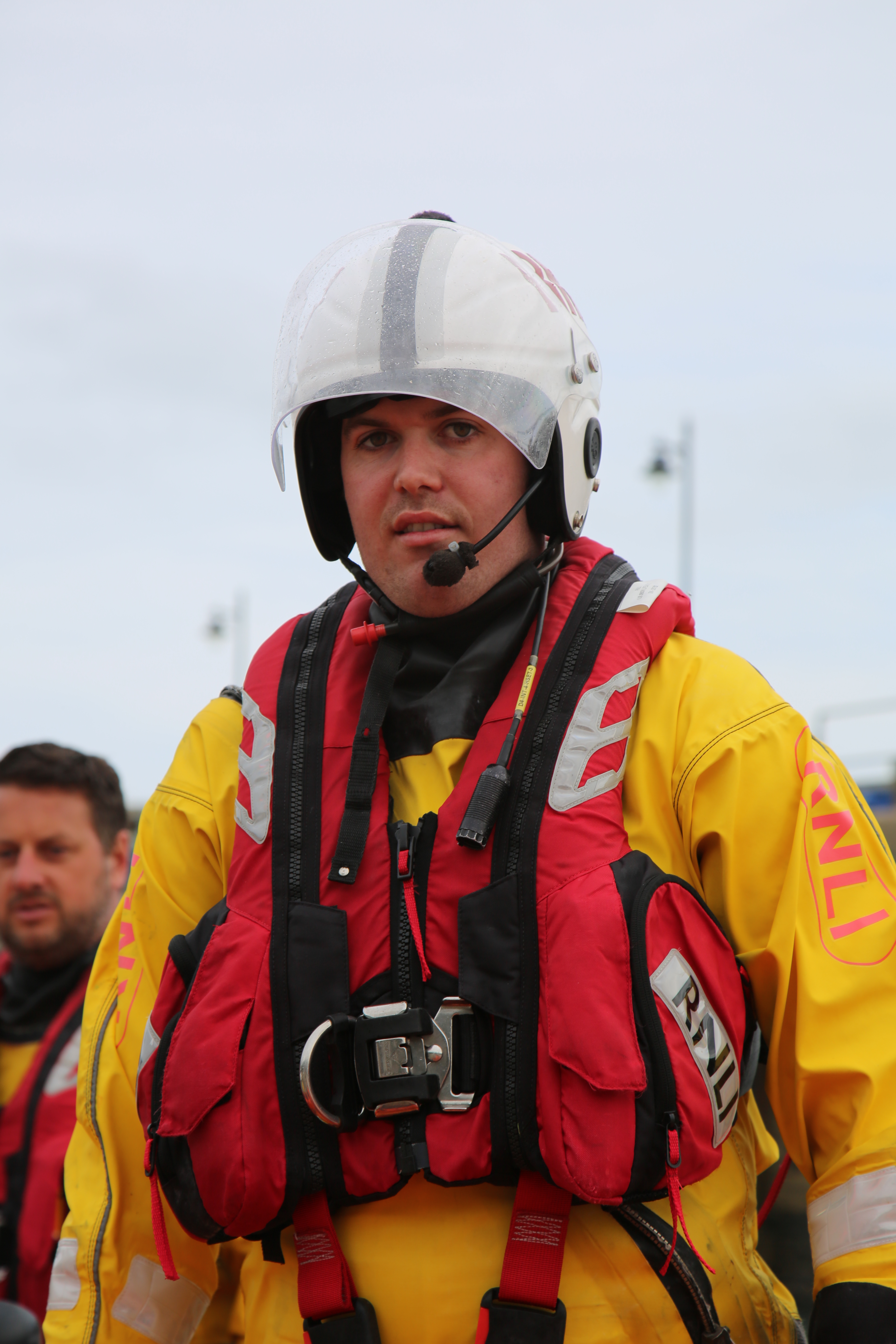 Mike kitted up in protective gear in his role as helm at Newquay RNLI, wearing helmet, drysuit and lifejacket.