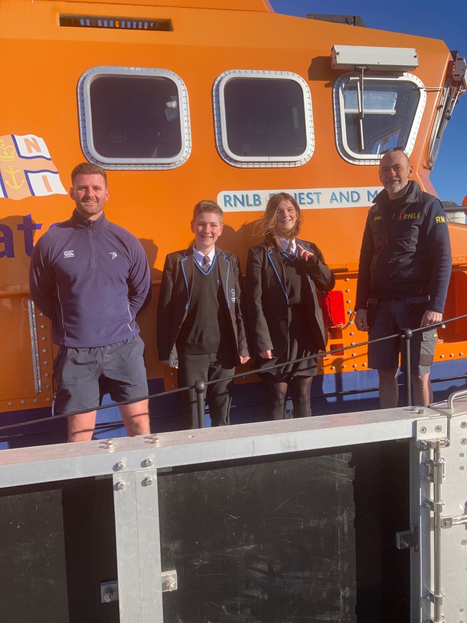 Mr Pring and Millie and Luie from Hawking School with Coxwain Andy Sargent